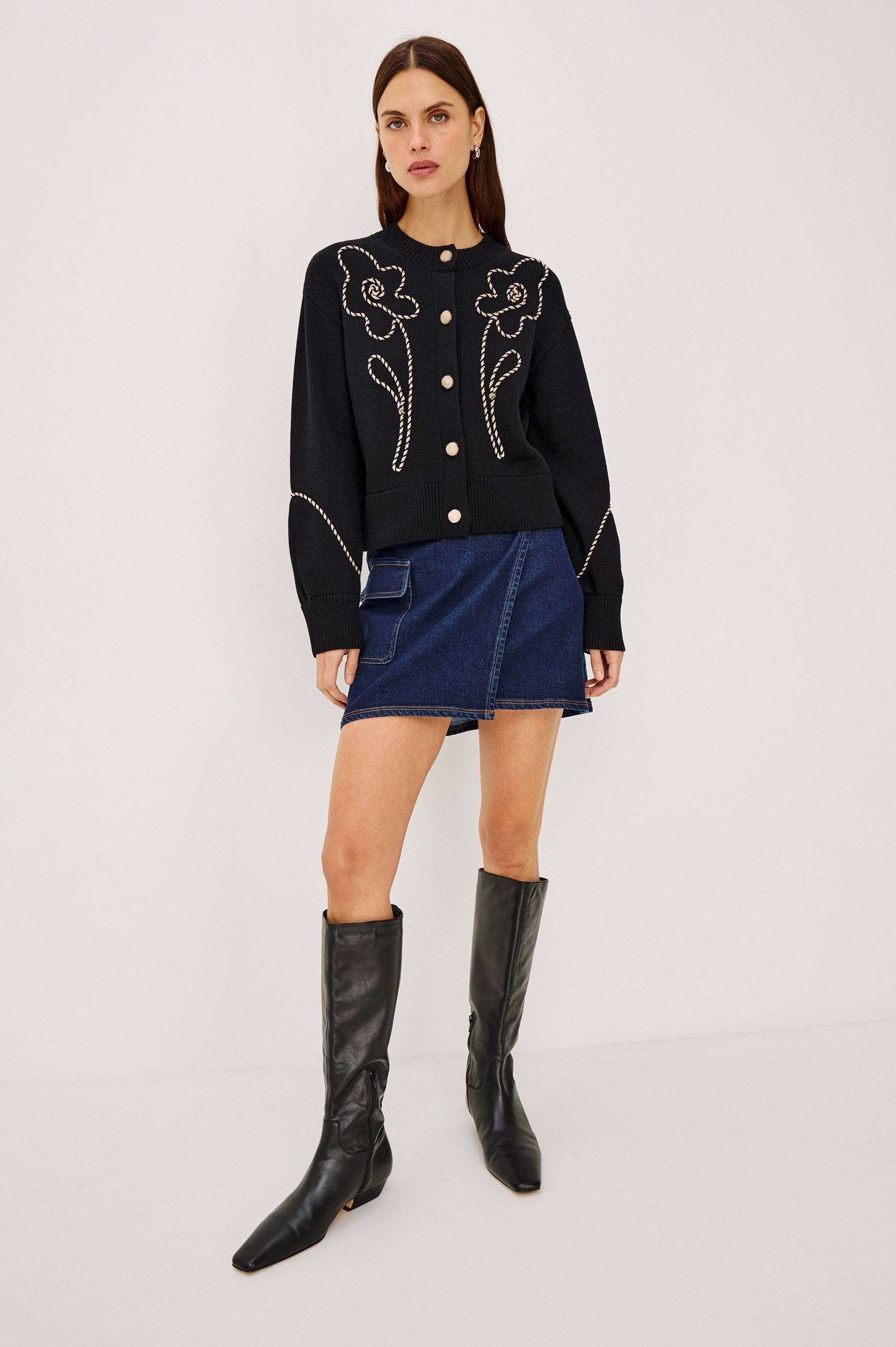 Dillon Mini Skirt in Midweight Denim With Mid-Rise, Asymmetric Wrap Design, Toggle Closure at Side Waist, Contrast Topstitching, and Utility Patch Pocket in Rinse Indigo Colorway - Full Body Front View Featured on Model