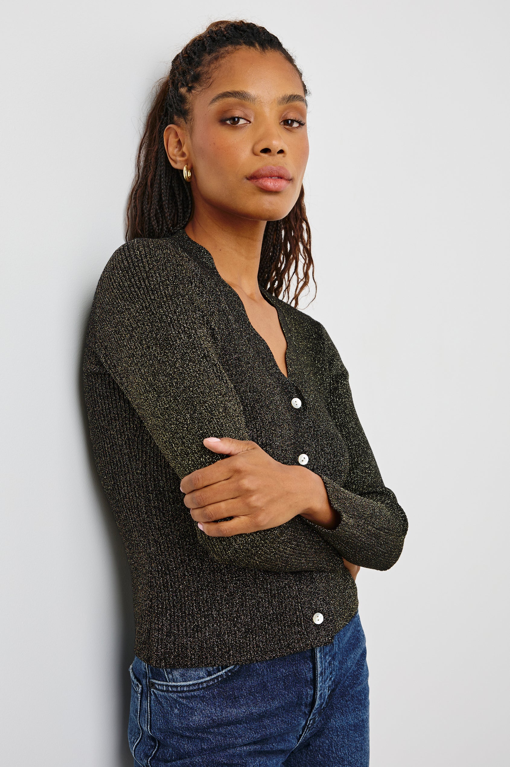 Dita Long-Sleeve Cardigan with Button Closure, a V neck and Scalloped Trim along the Neckline and Closure in Gold Lurex Colorway - Side View Featured on Model
