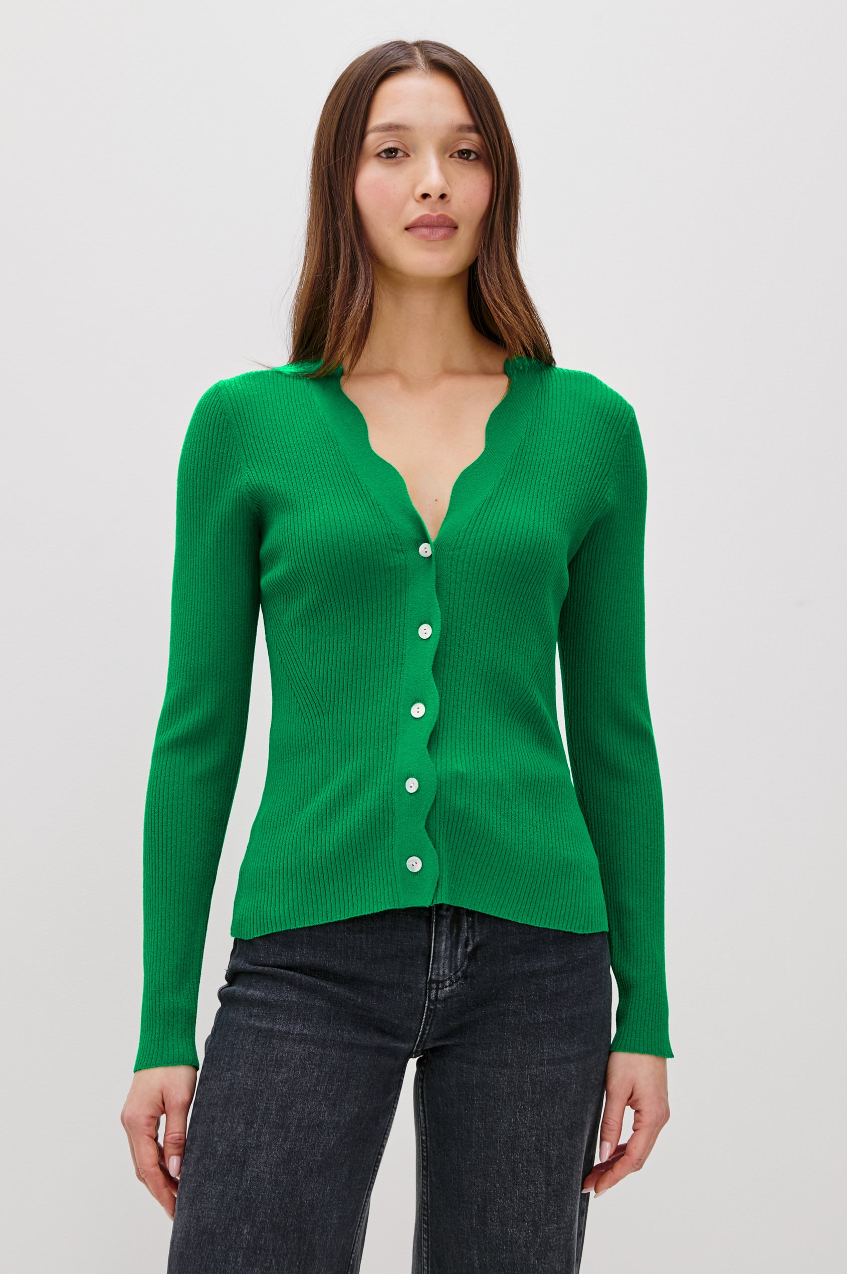 Dita Long-Sleeve Cardigan with Button Closure, a V neck and Scalloped Trim along the Neckline and Closure in Kelly Green Colorway - Front View Featured on Model