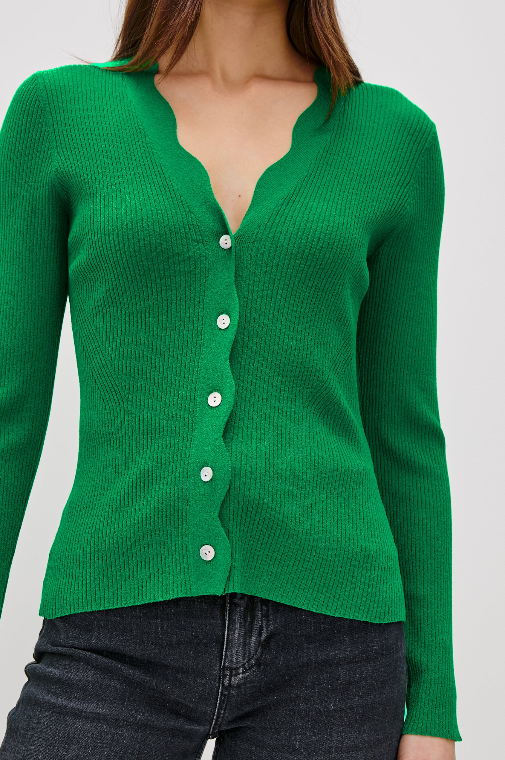 Dita Long-Sleeve Cardigan with Button Closure, a V neck and Scalloped Trim along the Neckline and Closure in Kelly Green Colorway - Front View Featured on Model