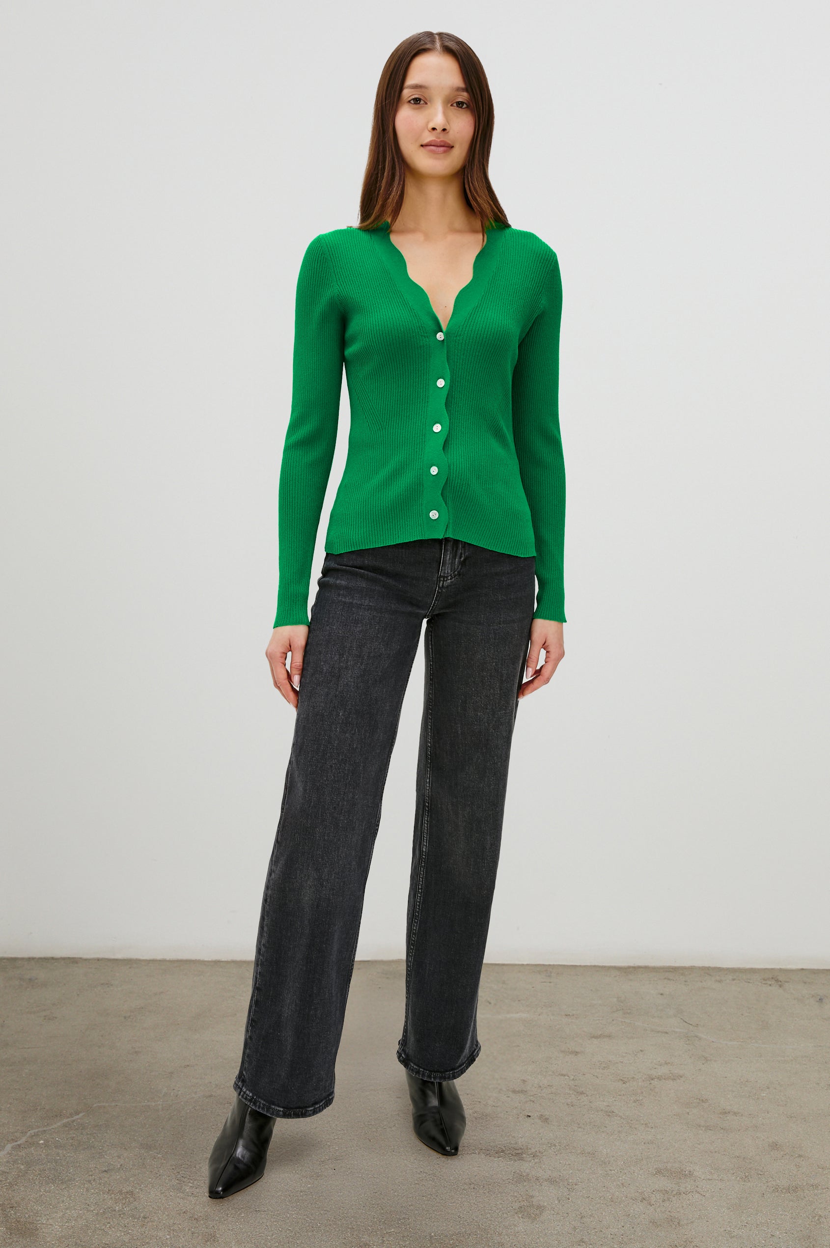 Dita Long-Sleeve Cardigan with Button Closure, a V neck and Scalloped Trim along the Neckline and Closure in Kelly Green Colorway - Front Full Body View Featured on Model
