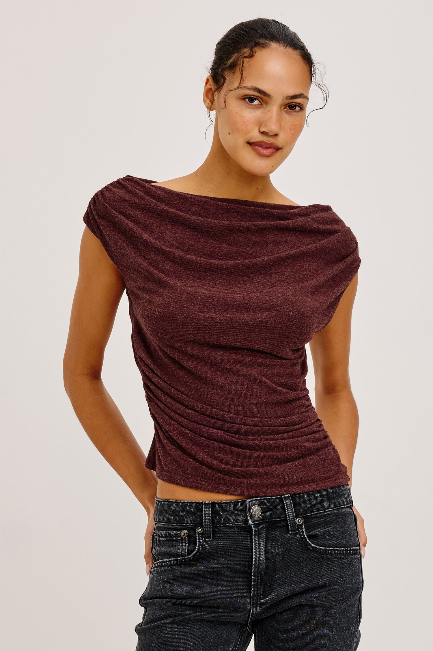 Dominic Top in Soft Jersey With Off-The-Shoulder One-Shoulder Design, Shirred Shoulders, and Ruched Waist in Merlot Colorway - Upper Body Front View Featured on Model