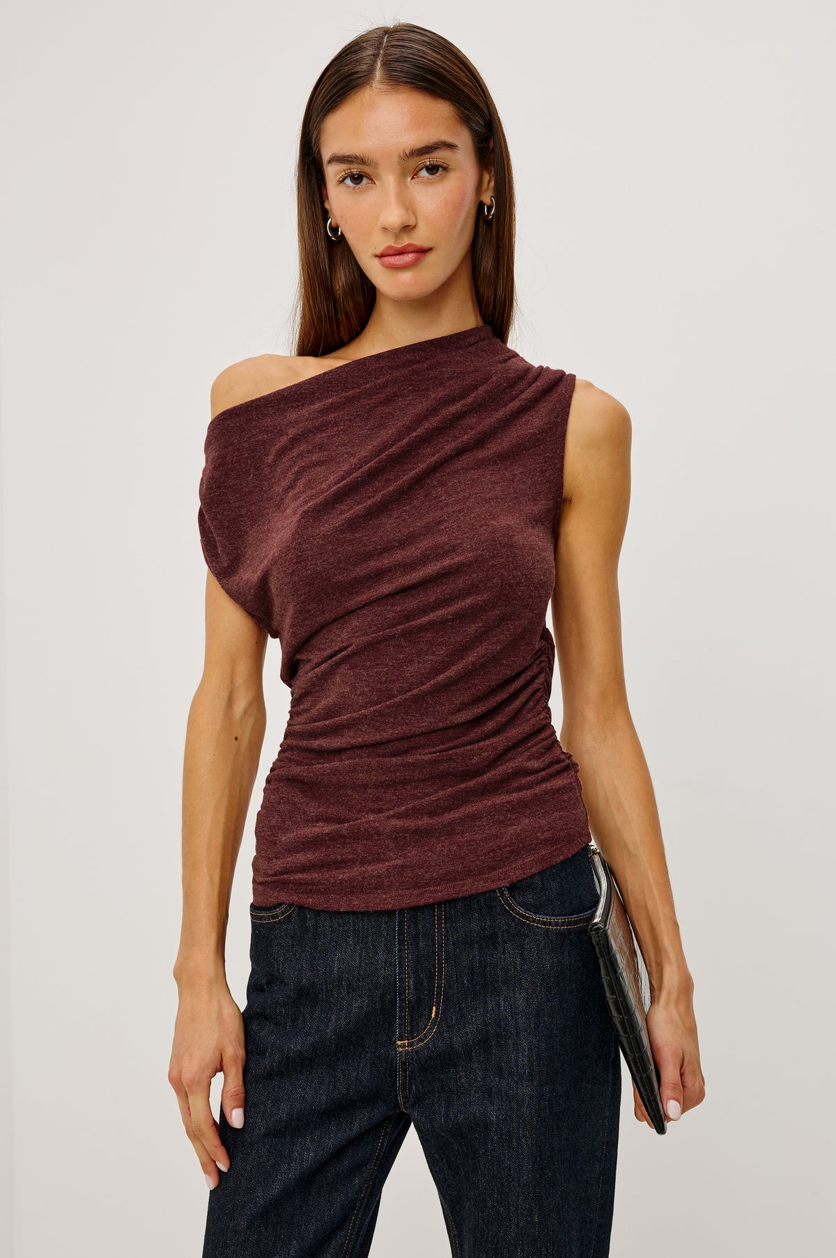 Dominic Top in Soft Jersey With Off-The-Shoulder One-Shoulder Design, Shirred Shoulders, and Ruched Waist in Merlot Colorway - Upper Body Front View Featured on Model