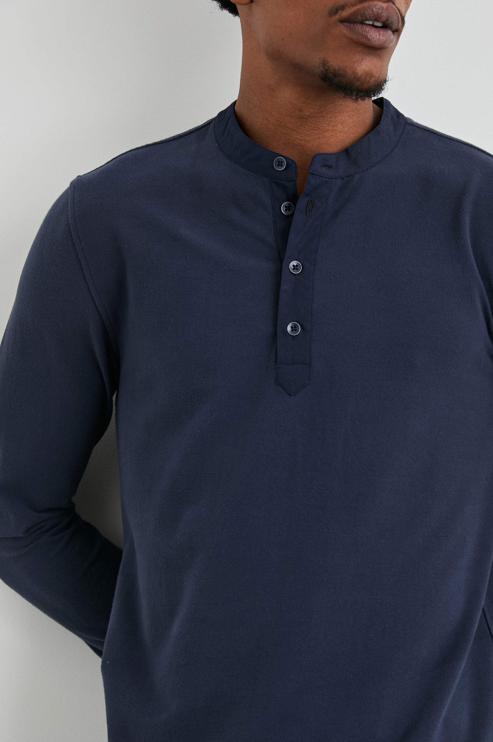 Dremond Long Sleeve Shirt with a Three Button Placket and Buttoned Cuffs in Perfect Navy Colorway - Front View Featured on Model