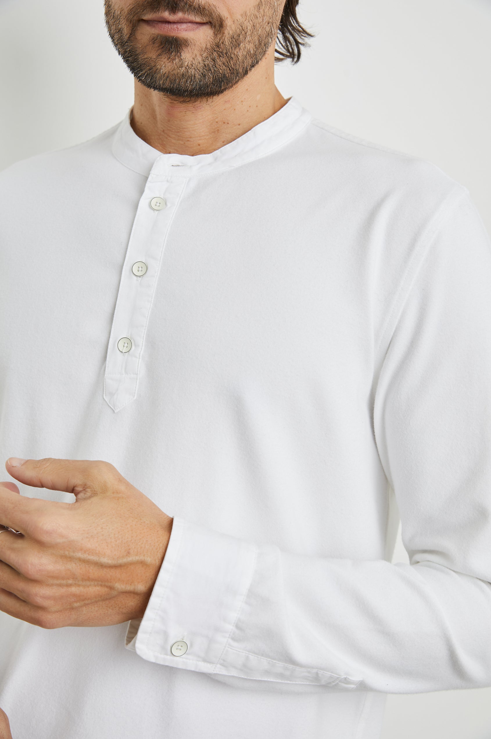 Dremond Long Sleeve Shirt with a Three Button Placket and Buttoned Cuffs in White Colorway - Front View Featured on Model