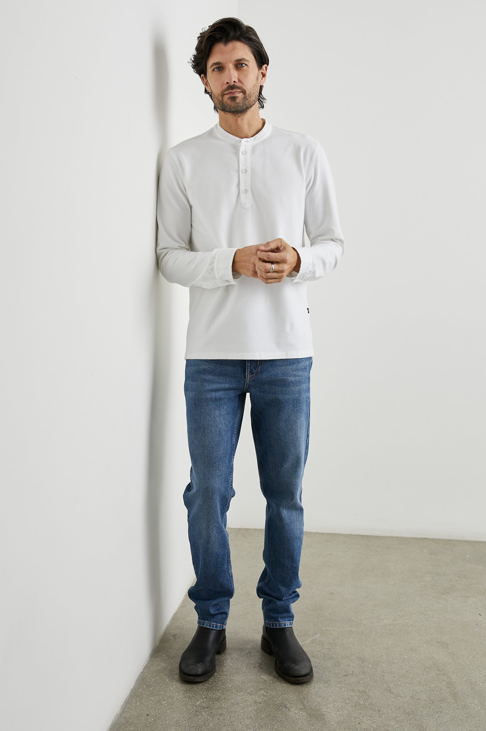 Dremond Long Sleeve Shirt with a Three Button Placket and Buttoned Cuffs in White Colorway - Front Full Body View Featured on Model