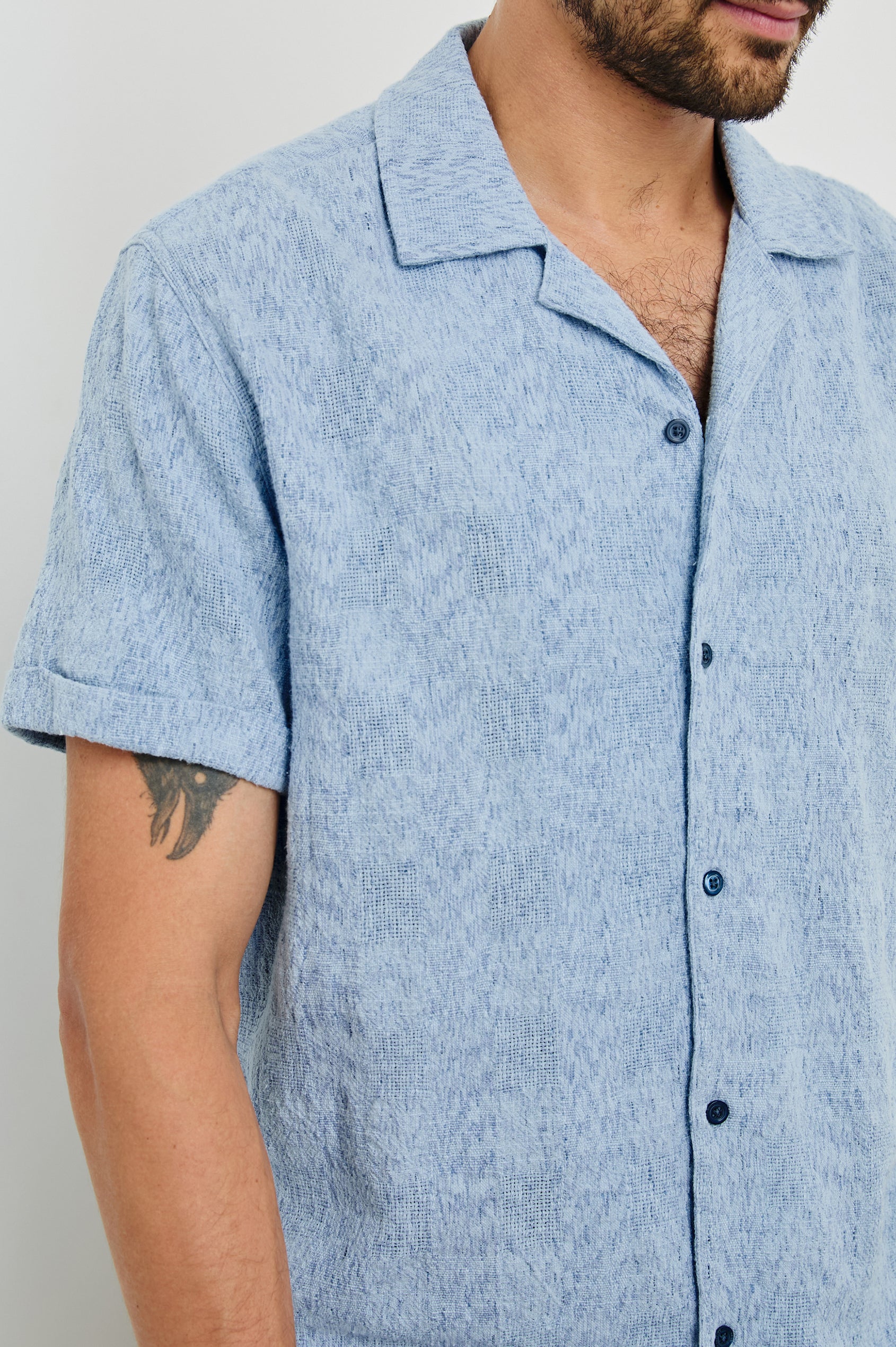 Dresden Short Sleeve Button Up with Rolled Cuffs in Cerulean Ikat Colorway - Front View Featured on Model