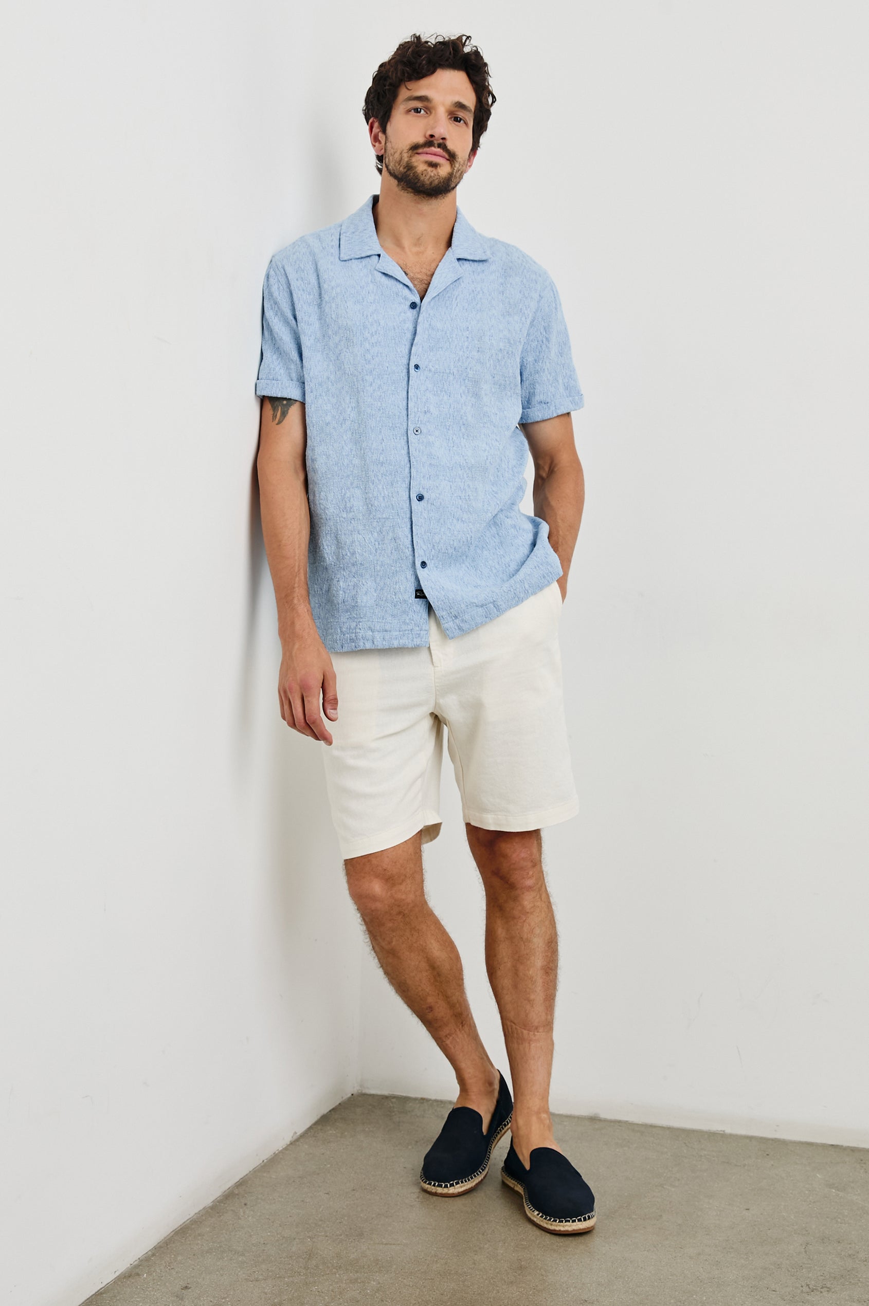 Dresden Short Sleeve Button Up with Rolled Cuffs in Cerulean Ikat Colorway - Front Full Body View Featured on Model