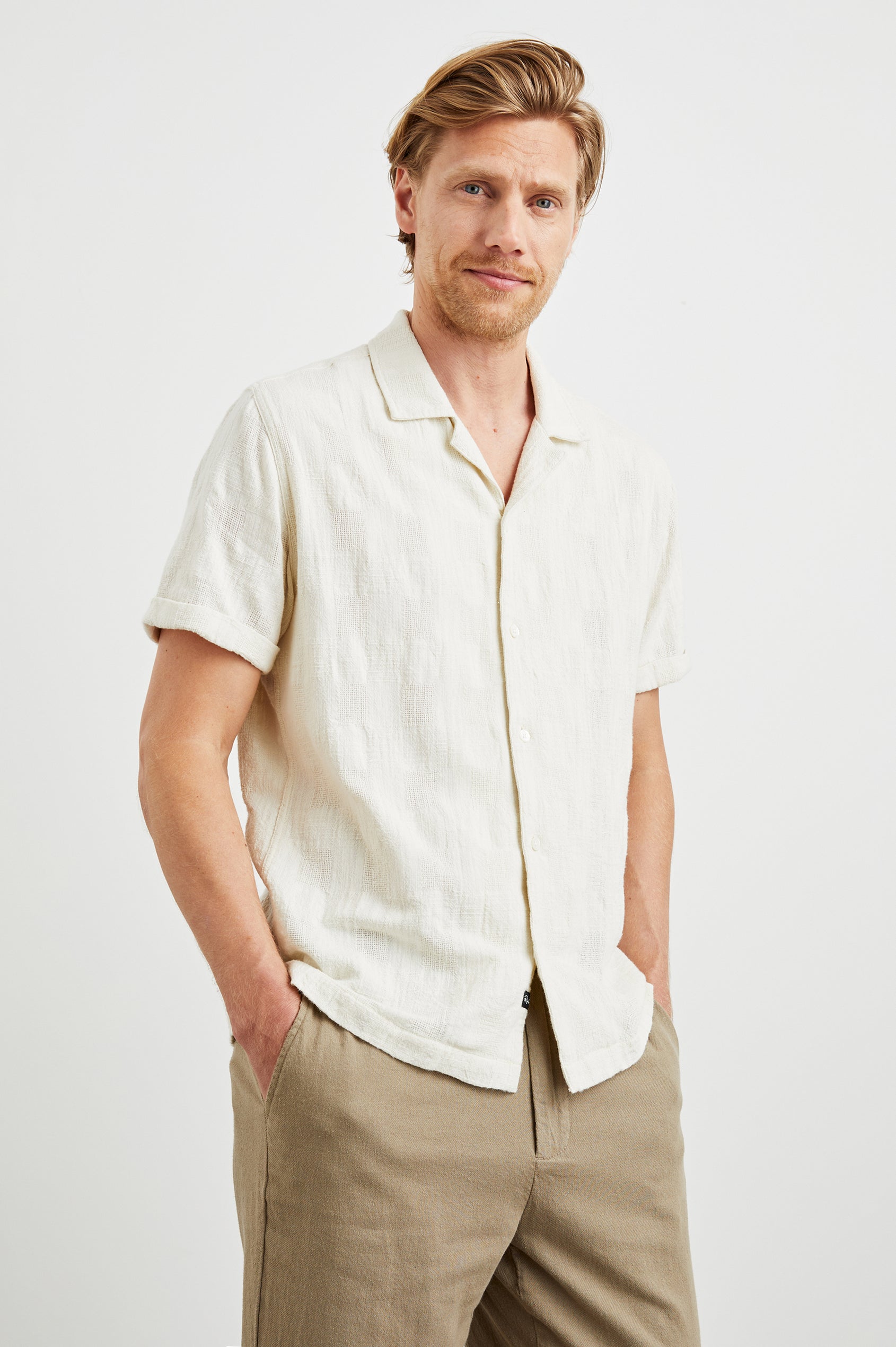 Dresden Short Sleeve Button Up with Rolled Cuffs in Parchment Colorway - Front View Featured on Model