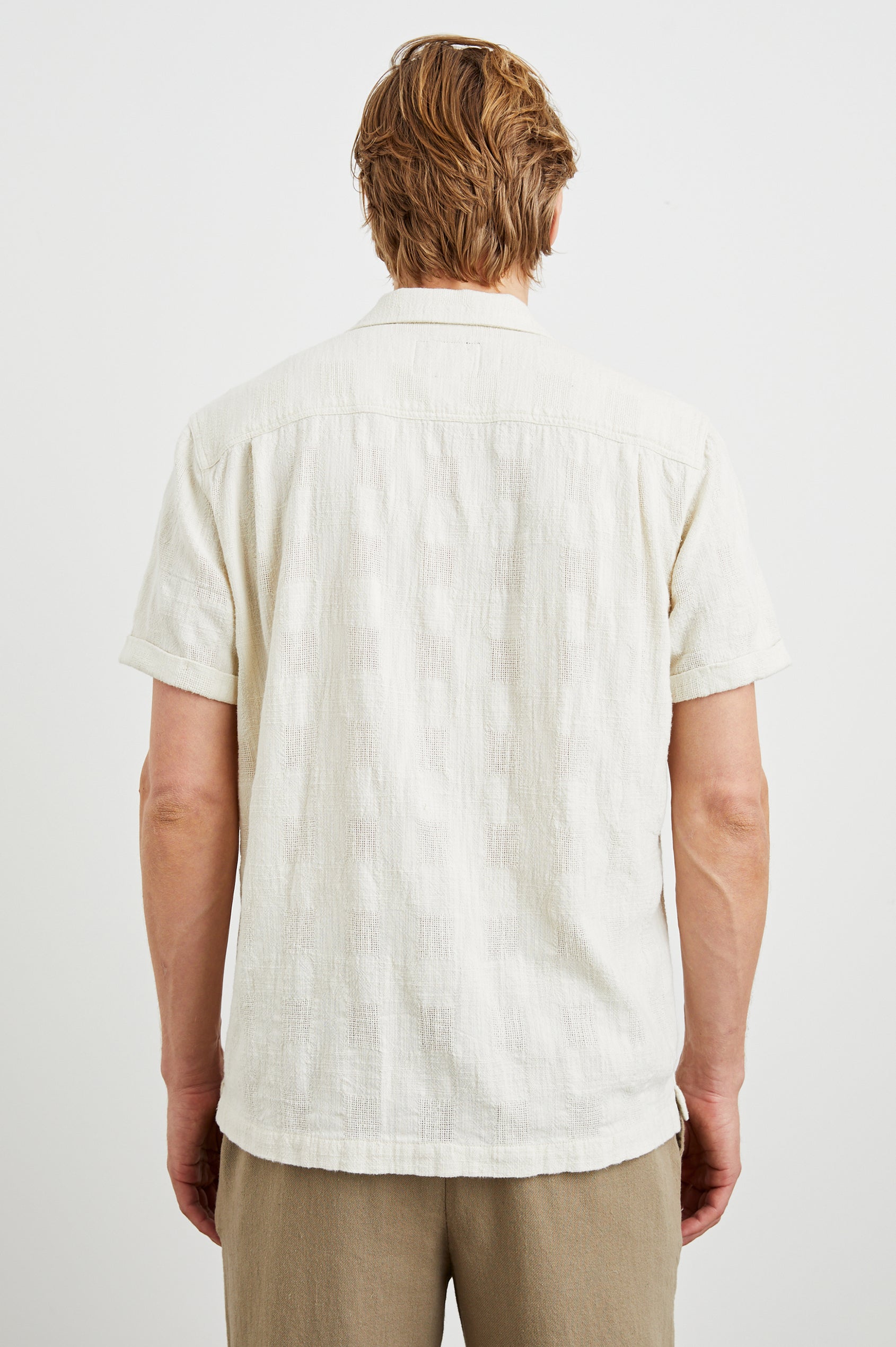 Dresden Short Sleeve Button Up with Rolled Cuffs in Parchment Colorway - Back View Featured on Model