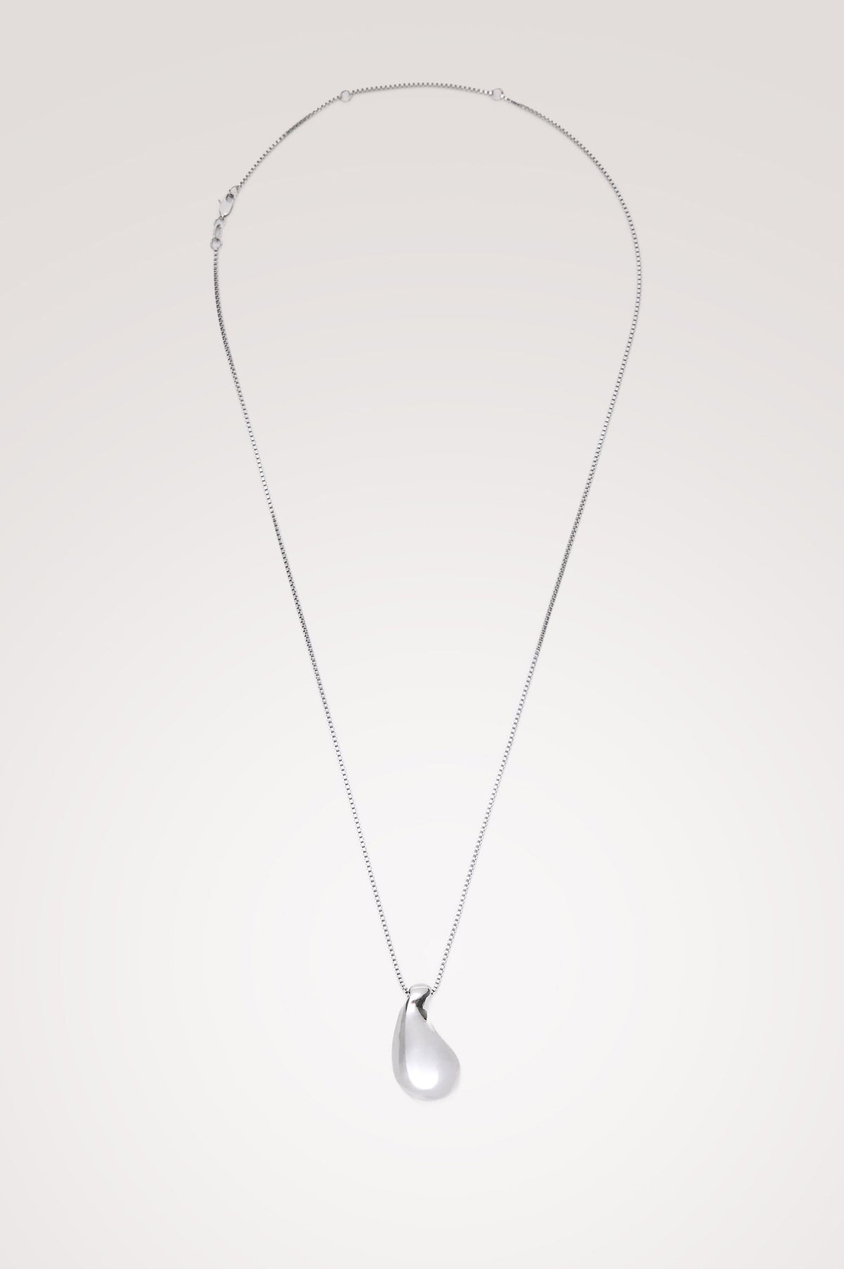 Drop Pendant Necklace With Substantial Organic-Shaped Pendant, Box Chain, and Lobster Clasp Closure in Silver Colorway - Flat Lay Product View Featured