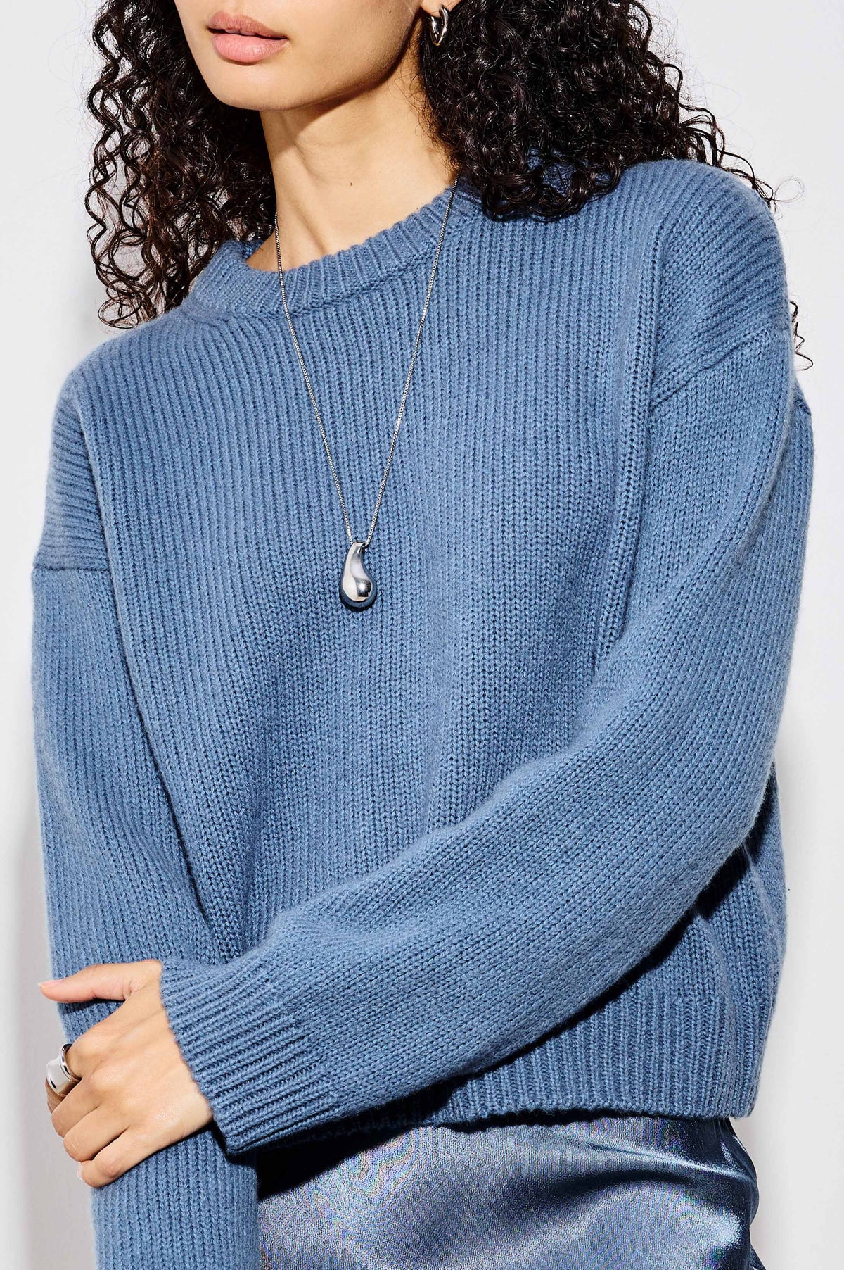 Drop Pendant Necklace With Substantial Organic-Shaped Pendant, Box Chain, and Lobster Clasp Closure in Silver Colorway - Upper Body Front Close Up View Featured on Model