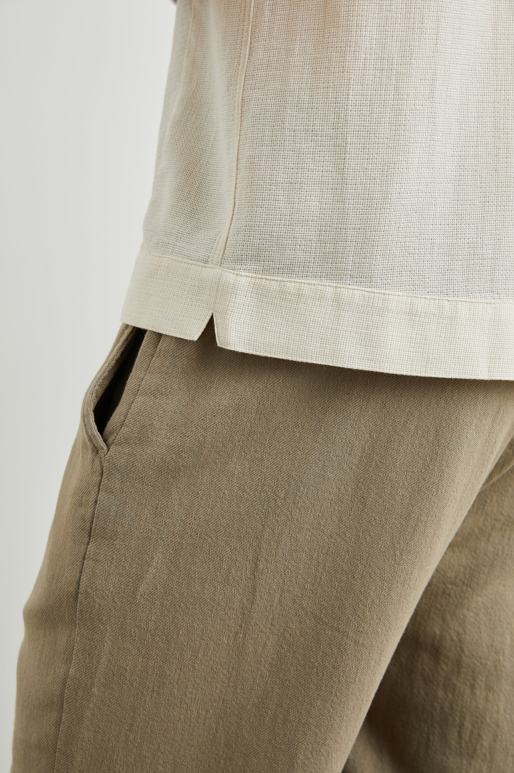Duke Short Sleeve Button Up with Rolled Cuffs and in Parchment Wheat Colorway, Alternating Vertical Panels of Wheat and Parchment - Side View Featured on Model