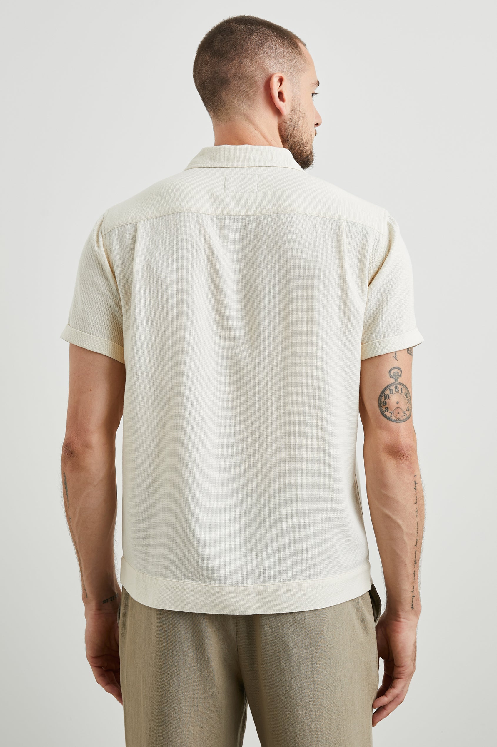 Duke Short Sleeve Button Up with Rolled Cuffs and in Parchment Wheat Colorway, Alternating Vertical Panels of Wheat and Parchment - Back View Featured on Model
