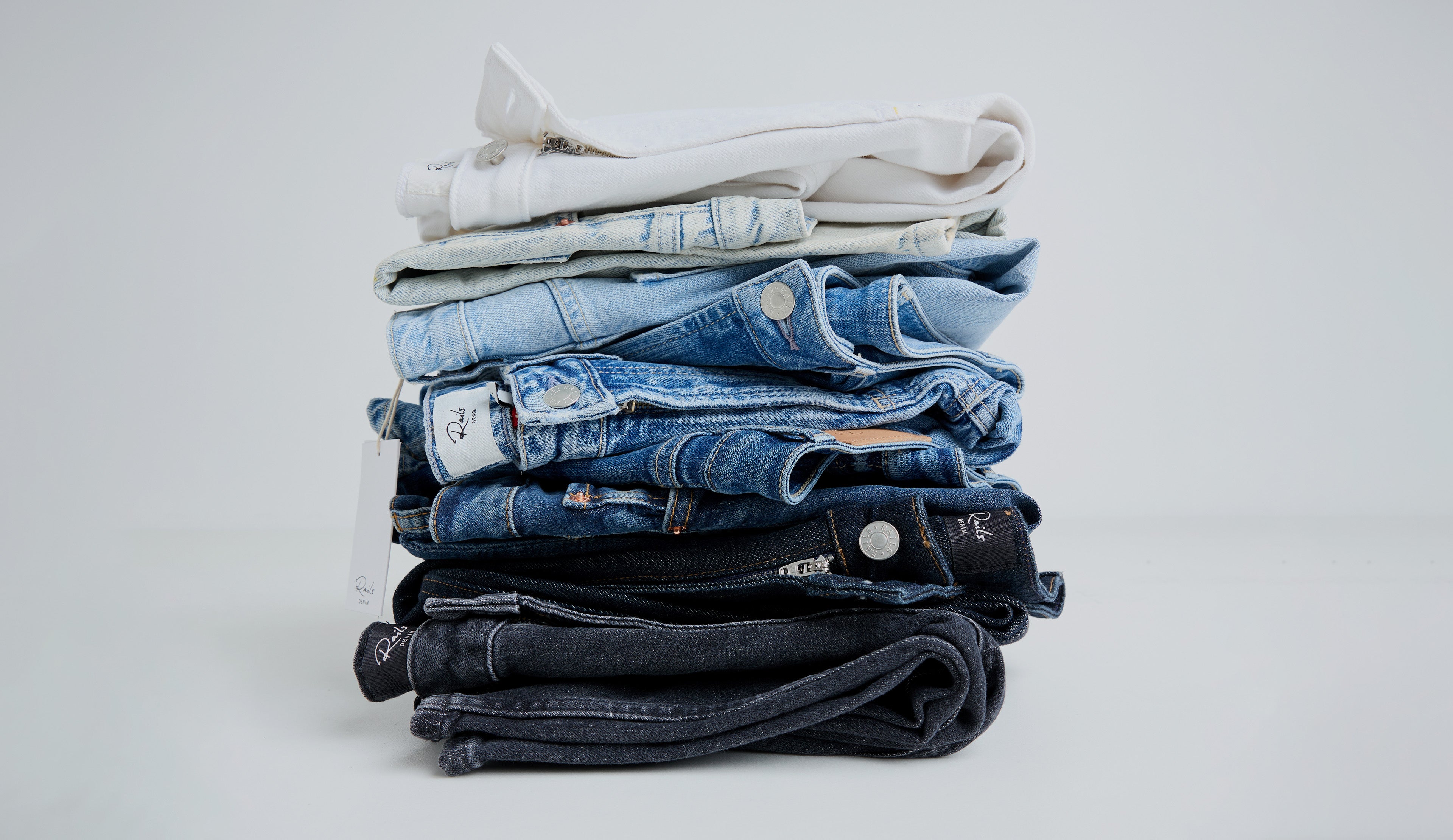 stacked variations of different color denim