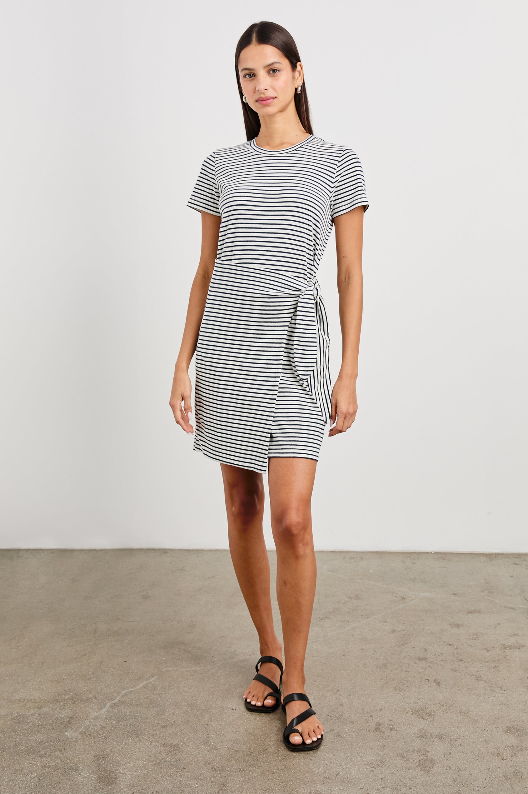 Edie Above-Knee Dress with Short Sleeves, Crew Neckline and Adjustable Wrap Tie At Waist in Ivory Navy Micro Stripe Colorway, Horizontal Stripes - Front Full Body View Featured on Model