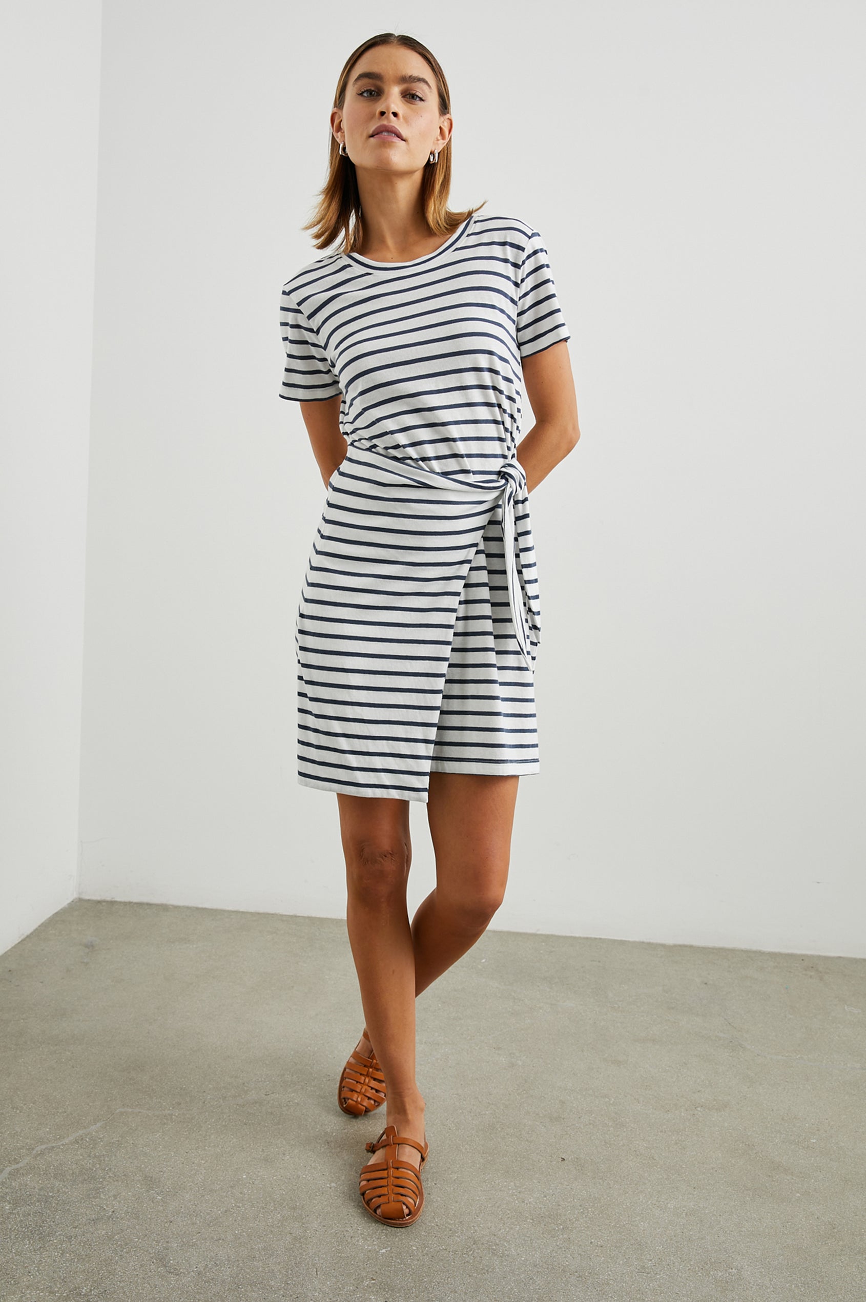 Edie Above-Knee Dress with Short Sleeves, Crew Neckline and Adjustable Wrap Tie At Waist in Ivory Navy Stripe Colorway, Horizontal Stripes - Front Full Body View Featured on Model