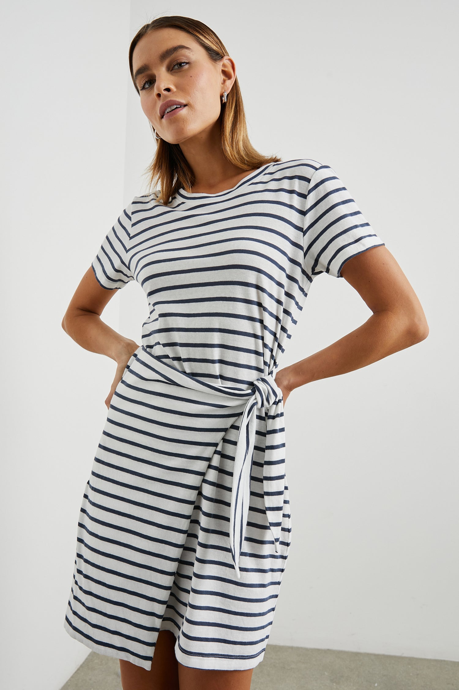 Edie Above-Knee Dress with Short Sleeves, Crew Neckline and Adjustable Wrap Tie At Waist in Ivory Navy Stripe Colorway, Horizontal Stripes - Front View Featured on Model