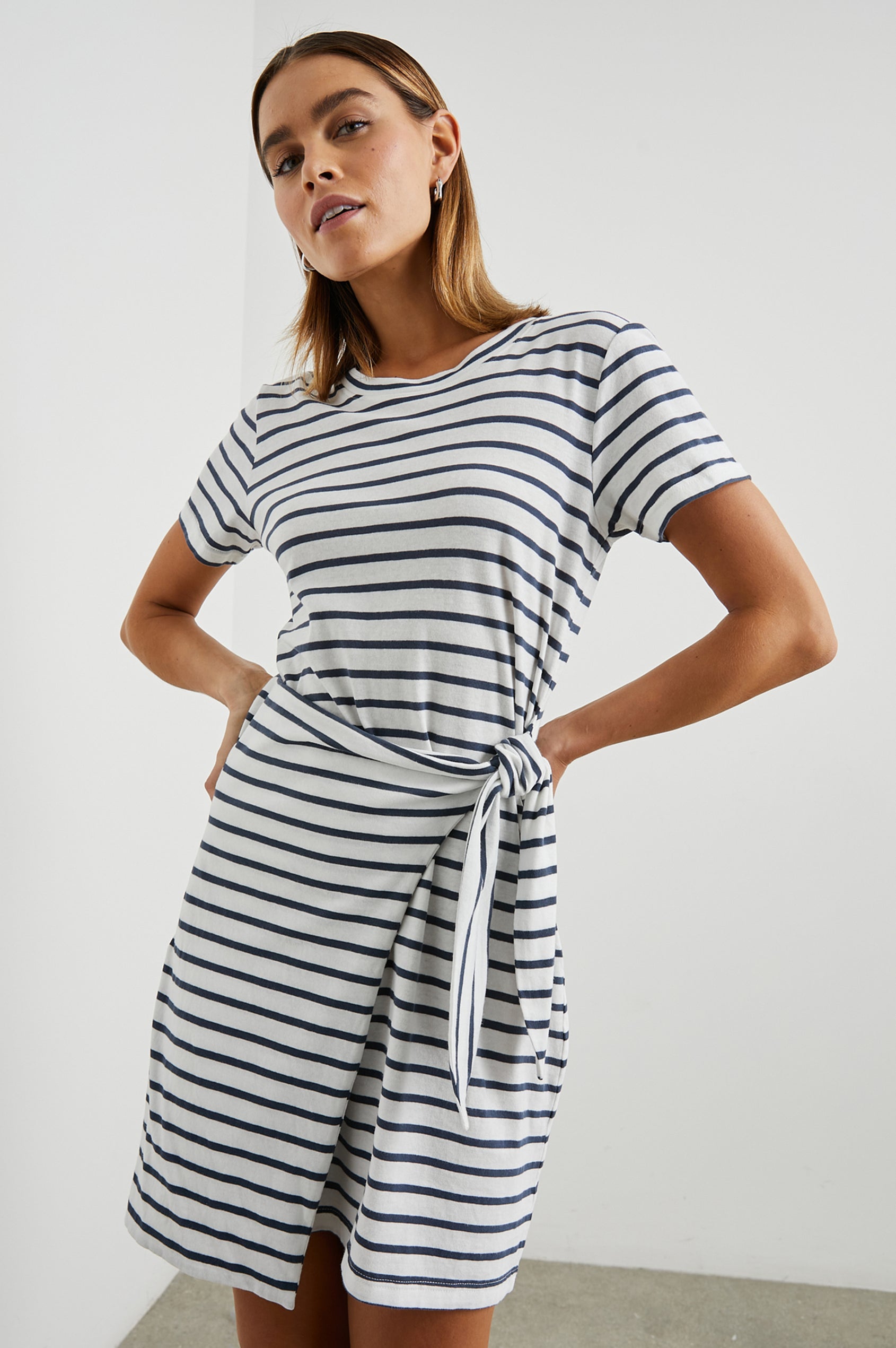 Edie Above-Knee Dress with Short Sleeves, Crew Neckline and Adjustable Wrap Tie At Waist in Ivory Navy Stripe Colorway, Horizontal Stripes - Front View Featured on Model