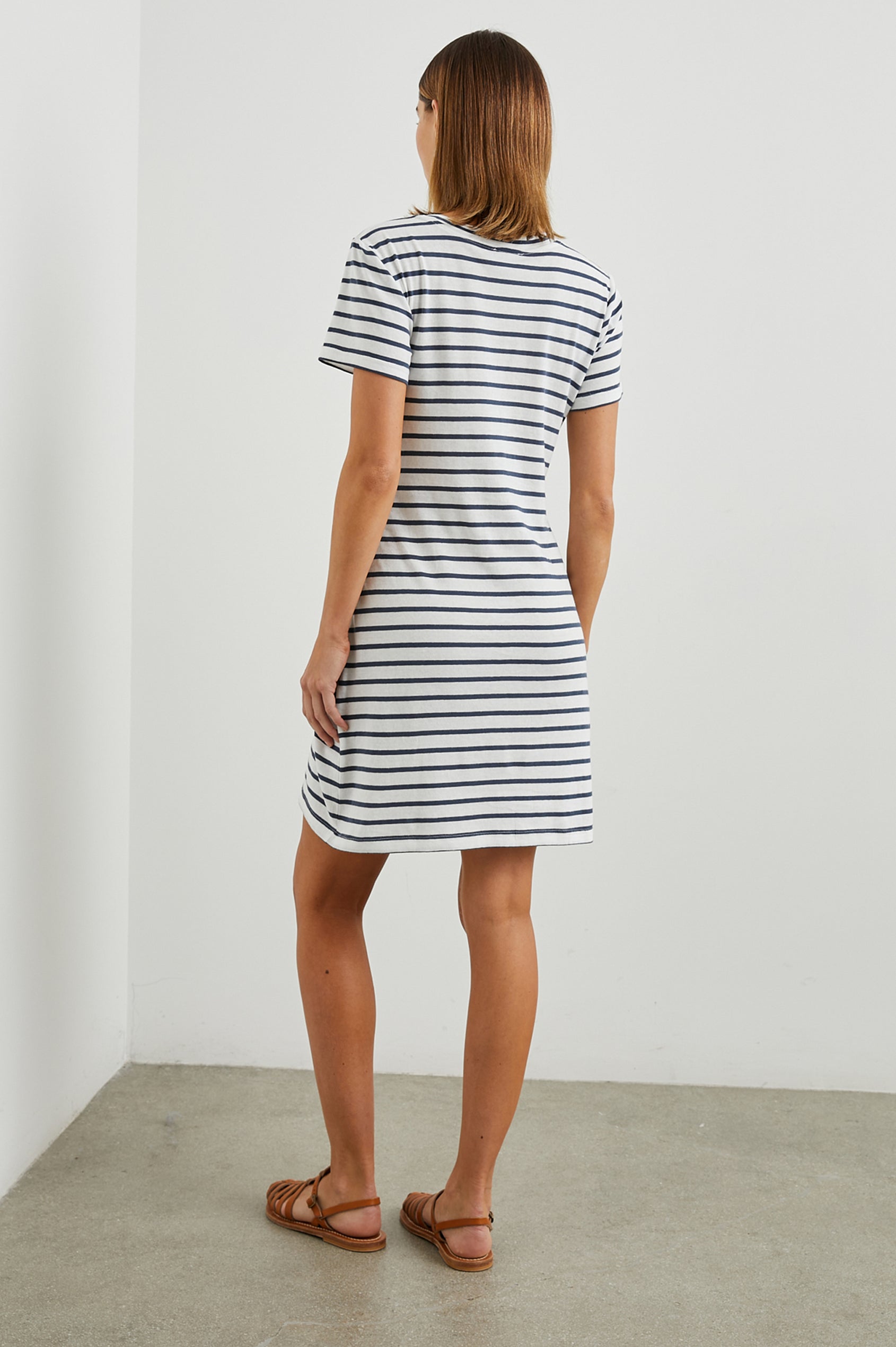 Edie Above-Knee Dress with Short Sleeves, Crew Neckline and Adjustable Wrap Tie At Waist in Ivory Navy Stripe Colorway, Horizontal Stripes - Back Full Body View Featured on Model