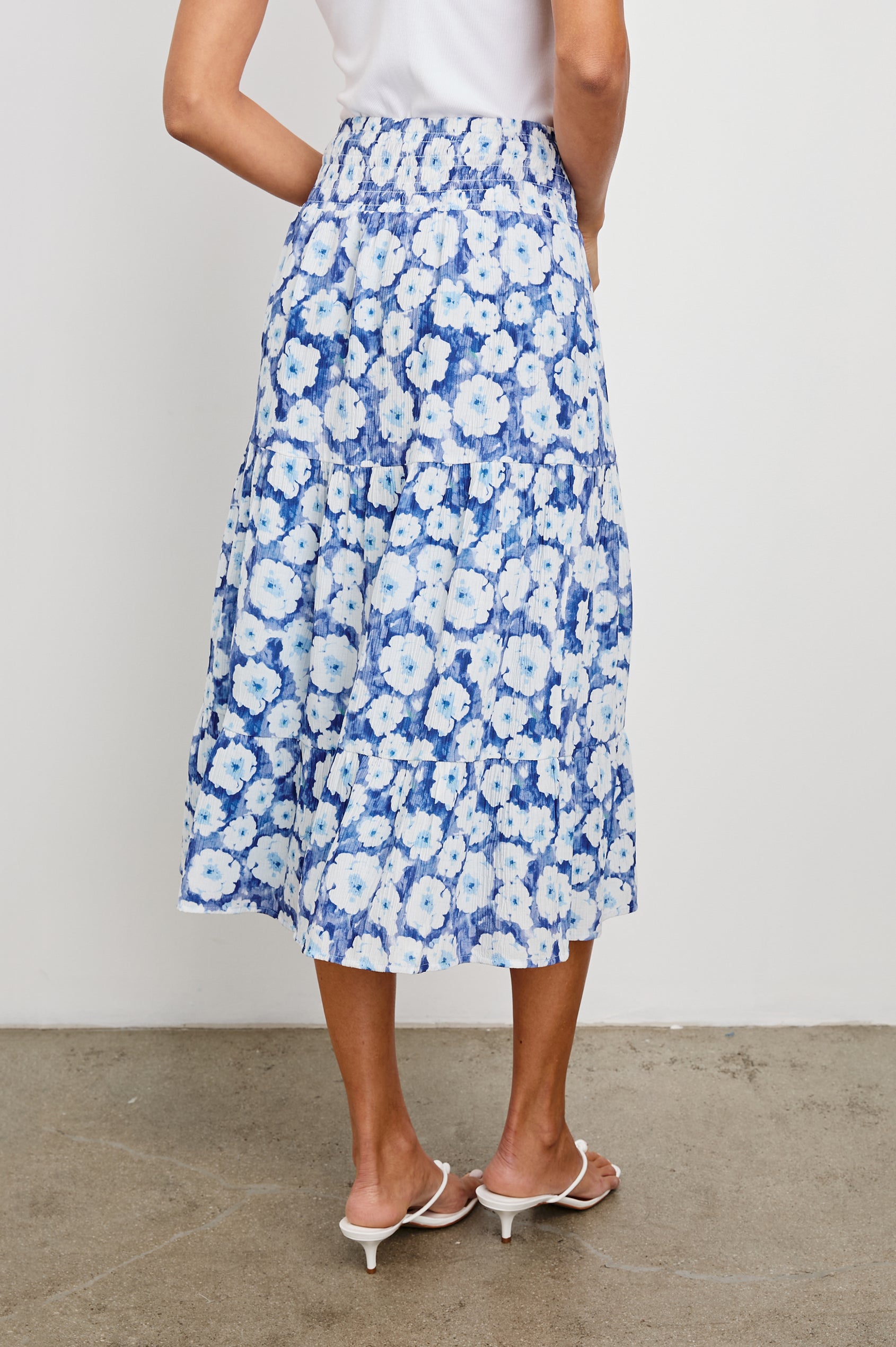 Edina Tiered Midi Skirt with Shirred High-Rise Waistline in Blue Floral Colorway, Blues and White - Front View Featured on Model