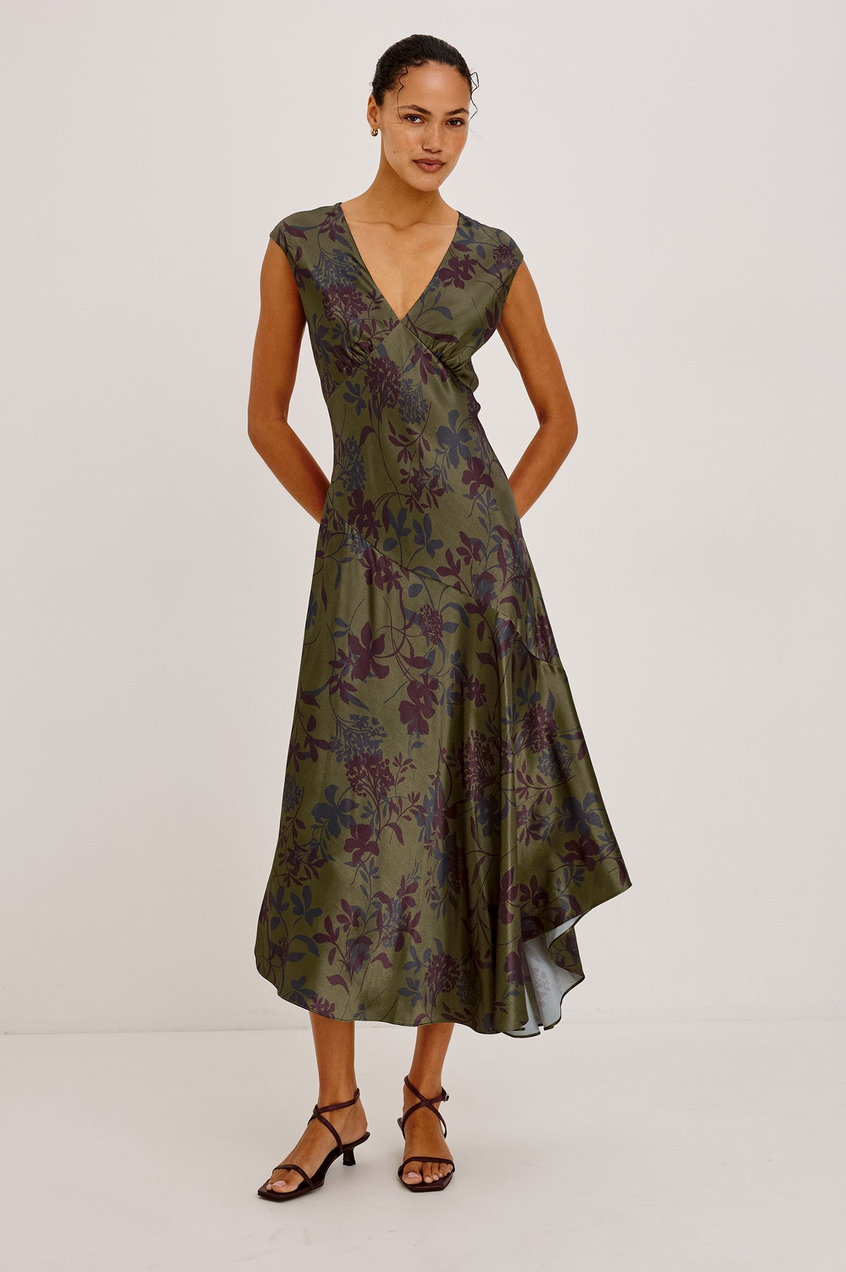 Eleni Dress in Floral Print Satin With V-Neck, Cap Sleeves, and Asymmetric Hem in Olive Dahlia Colorway - Upper Body Front View Featured on Model.