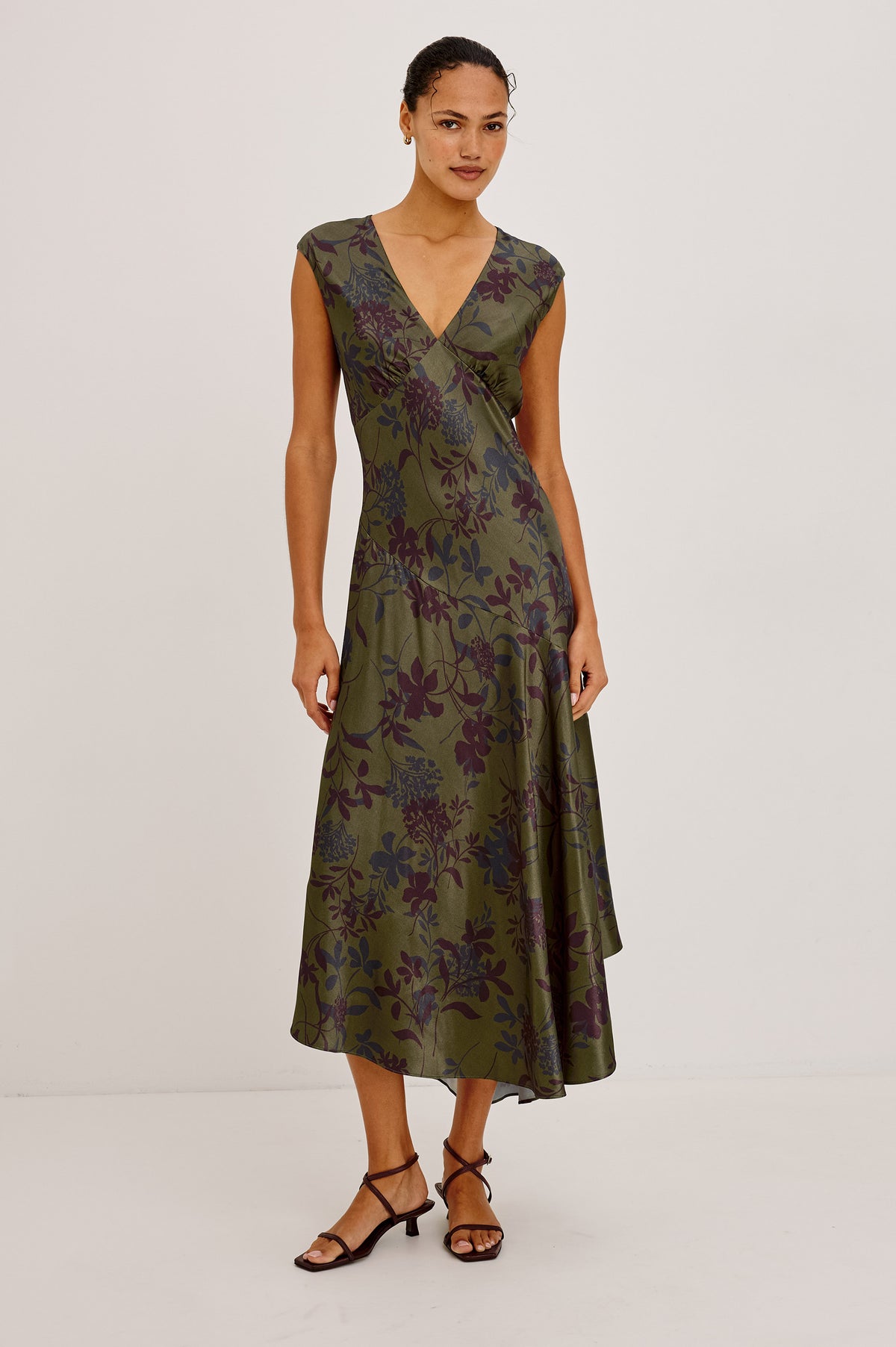Eleni Dress in Floral Print Satin With V-Neck, Cap Sleeves, and Asymmetric Hem in Olive Dahlia Colorway - Full Body Front View Featured on Model.
