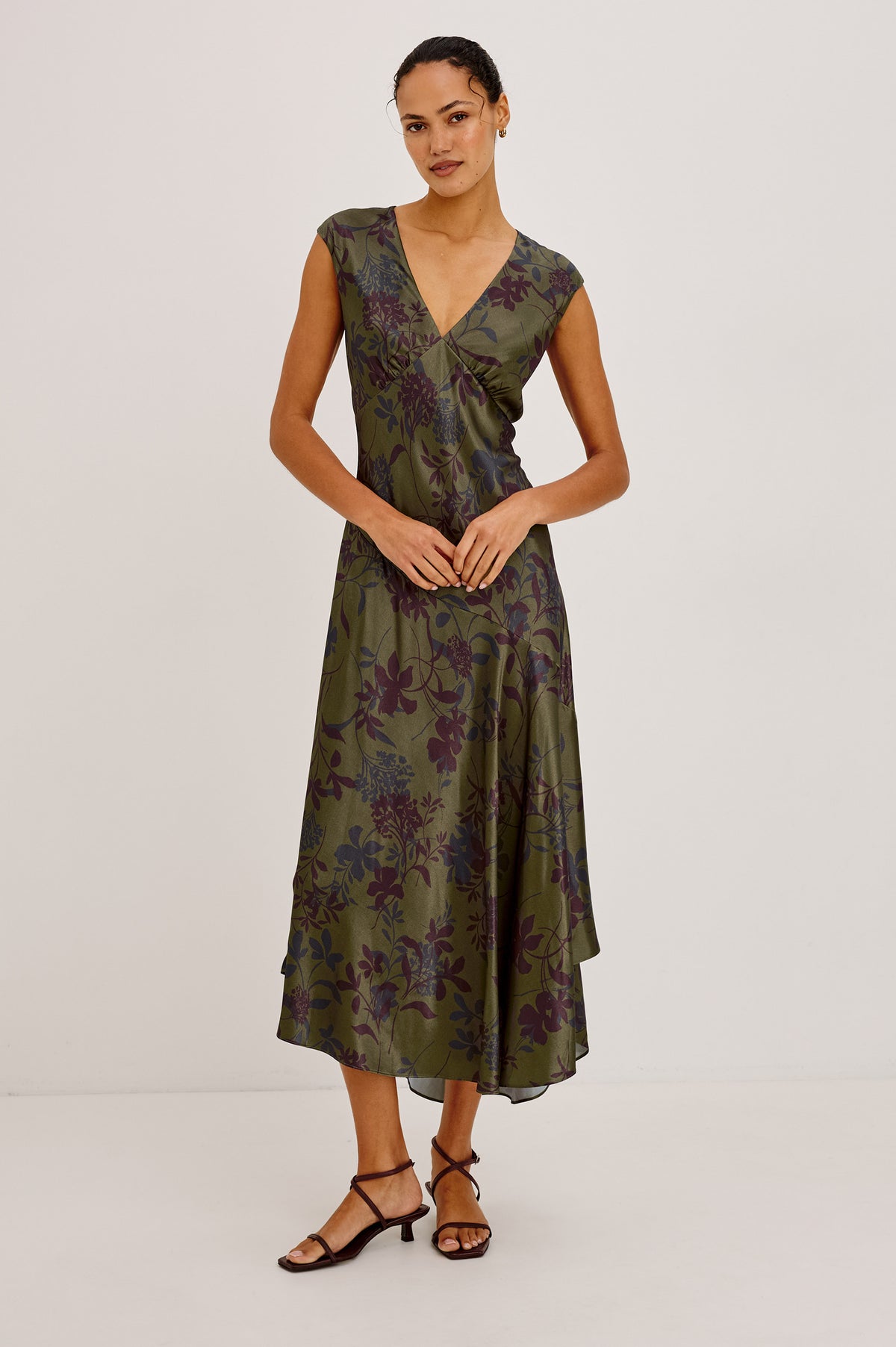 Eleni Dress in Floral Print Satin With V-Neck, Cap Sleeves, and Asymmetric Hem in Olive Dahlia Colorway - Front View Featured on Model.