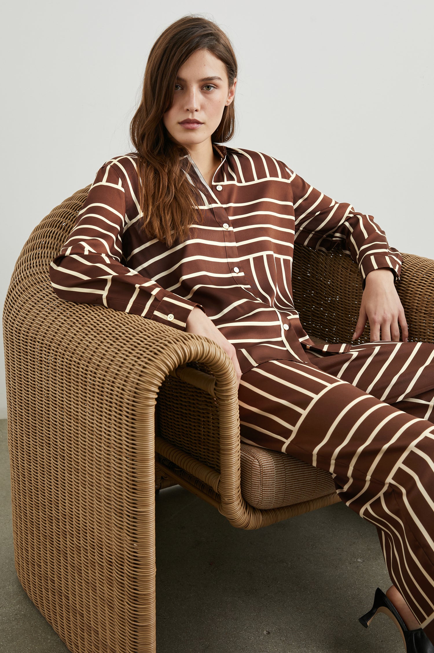 Elias Long Sleeve Button Up in Brown Line Art Colorway, Vertical and Horizontal White Lines on Brown - Front Full Body View Featured on Seated Model