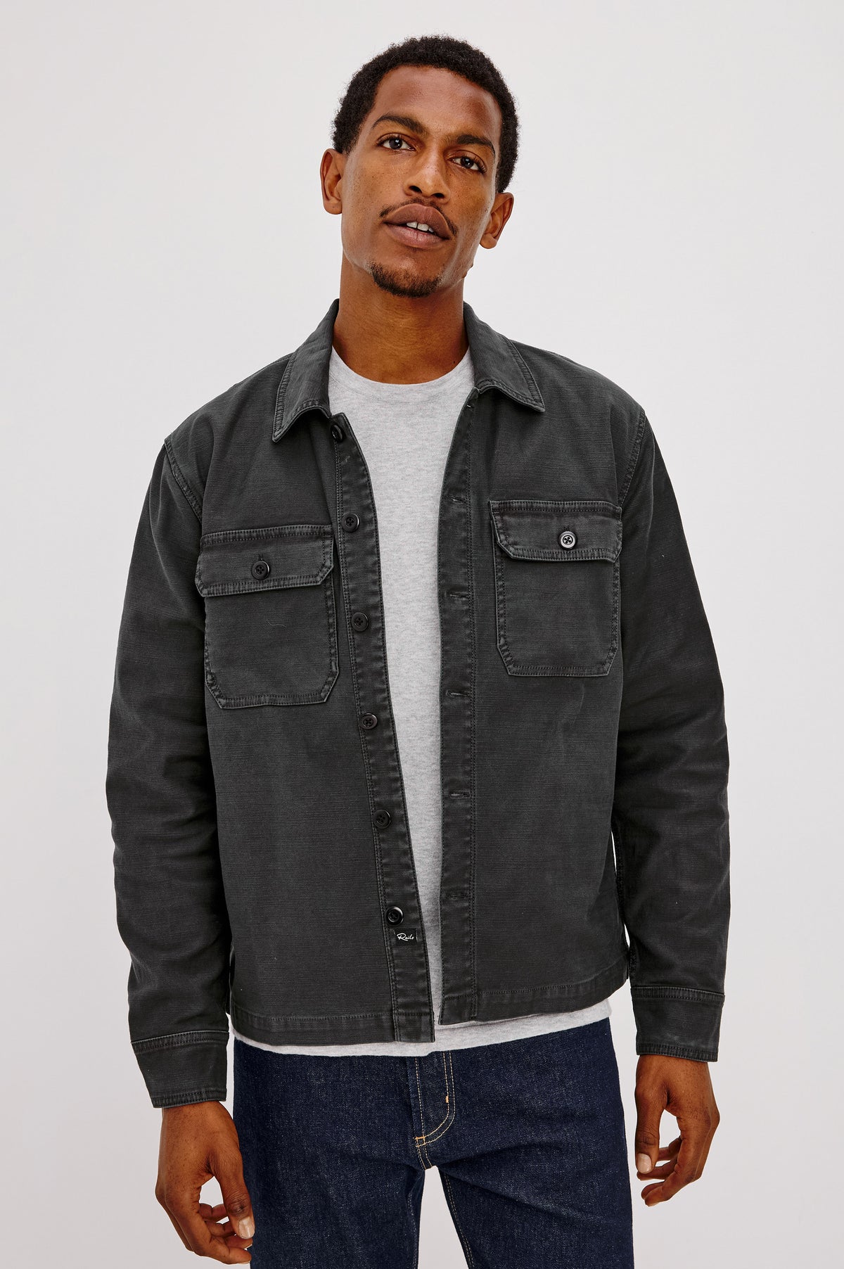 Eliot Shirt With Collar, Chest Buttoned Flap Pockets, Front Buttons, and Long Sleeves in Washed Black Colorway - Upper Body Front View Featured on Model