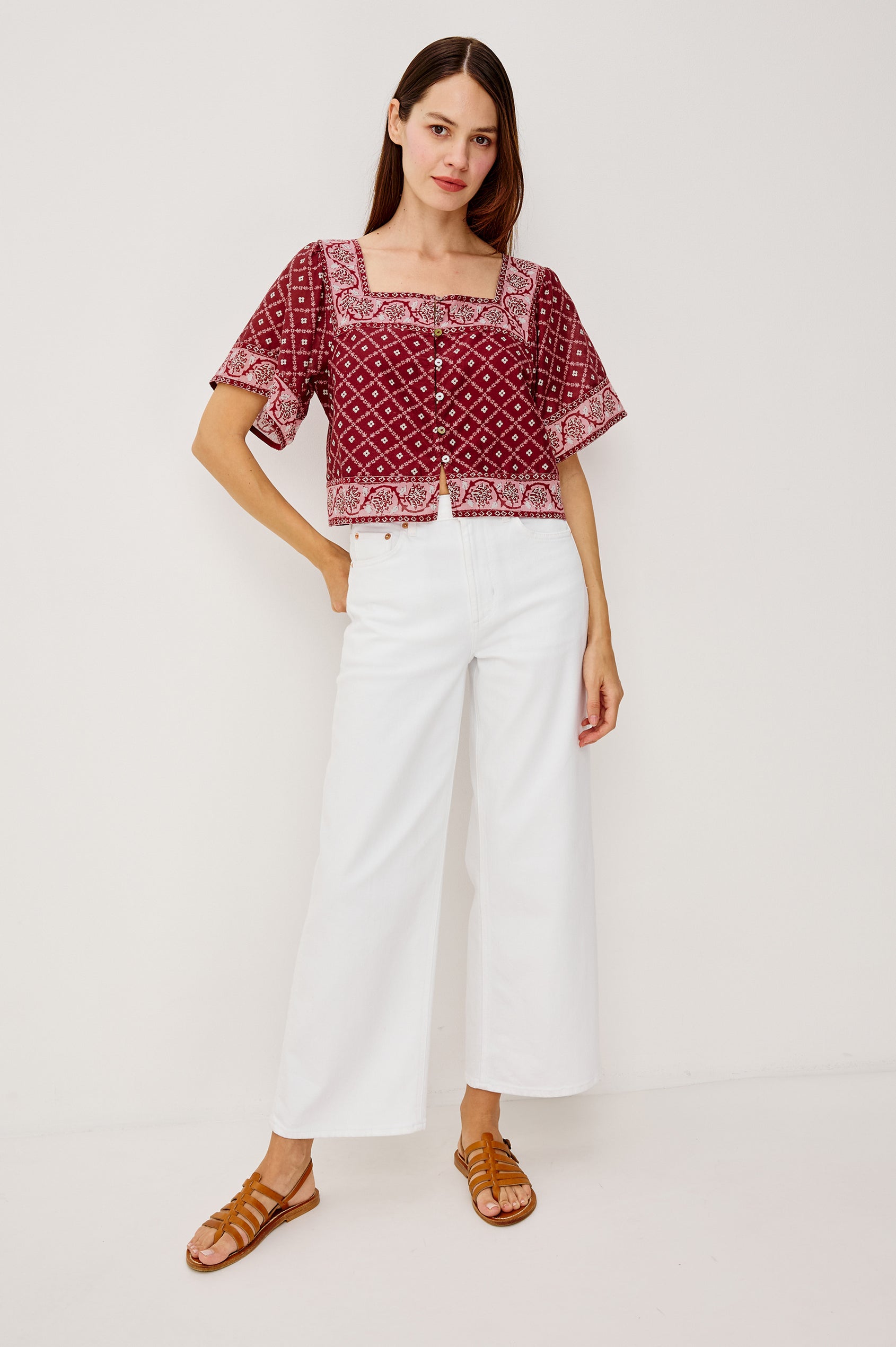 Ellen Cropped Cotton Shirt With Square Neckline Cropped Boxy Silhouette Front Buttons and Flared Short Sleeves in Flower Chain Colorway Upper Body Front View Featured on Model