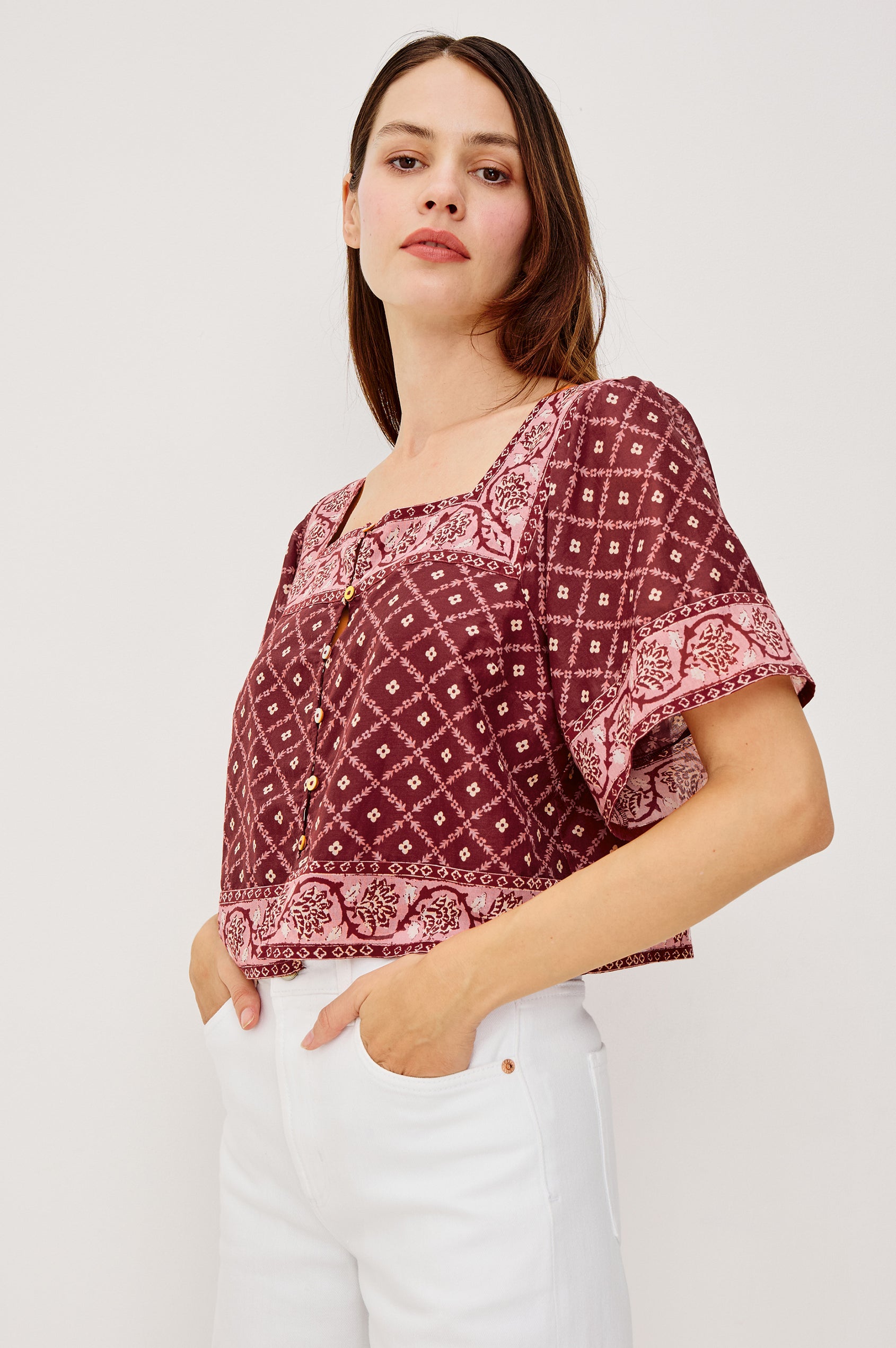 Ellen Cropped Cotton Shirt With Square Neckline Cropped Boxy Silhouette Front Buttons and Flared Short Sleeves in Flower Chain Colorway - Upper Body Front View Featured on Model
