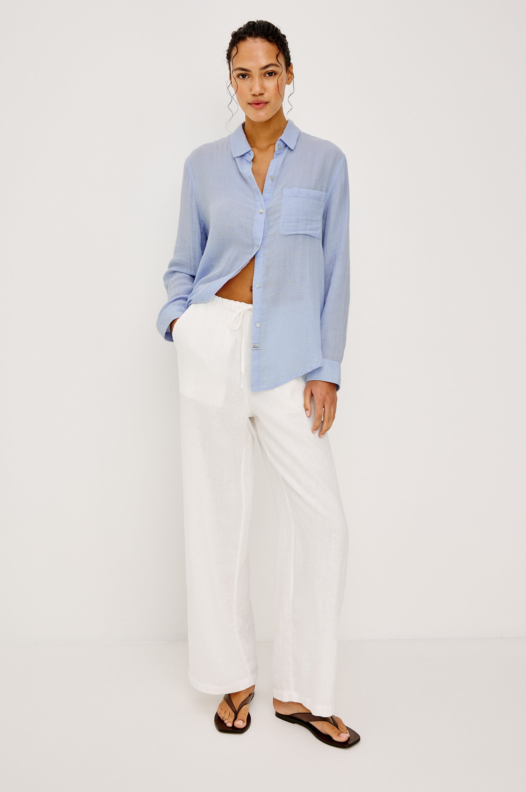 Ellis Relaxed Collared Button Front Shirt with Long Sleeves and a Chest Pocket in Baby Blue Colorway. Full Body Front View Shown on Model.