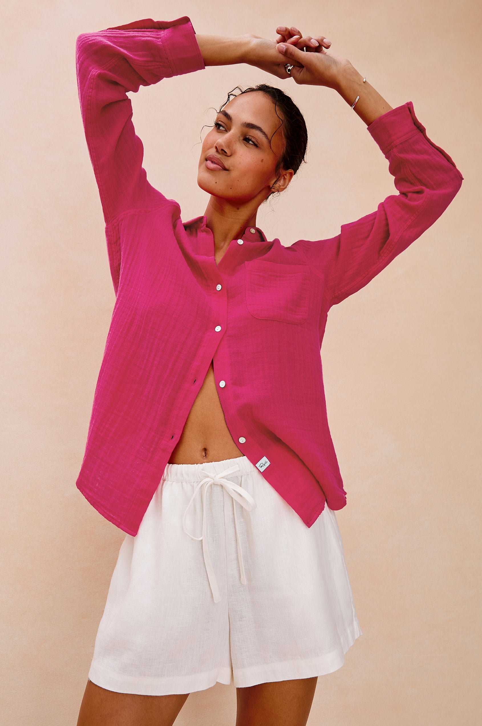 Ellis Relaxed Collared Button Front Shirt with Long Sleeves and a Chest Pocket in Raspberry Colorway. Front View Shown on Model.