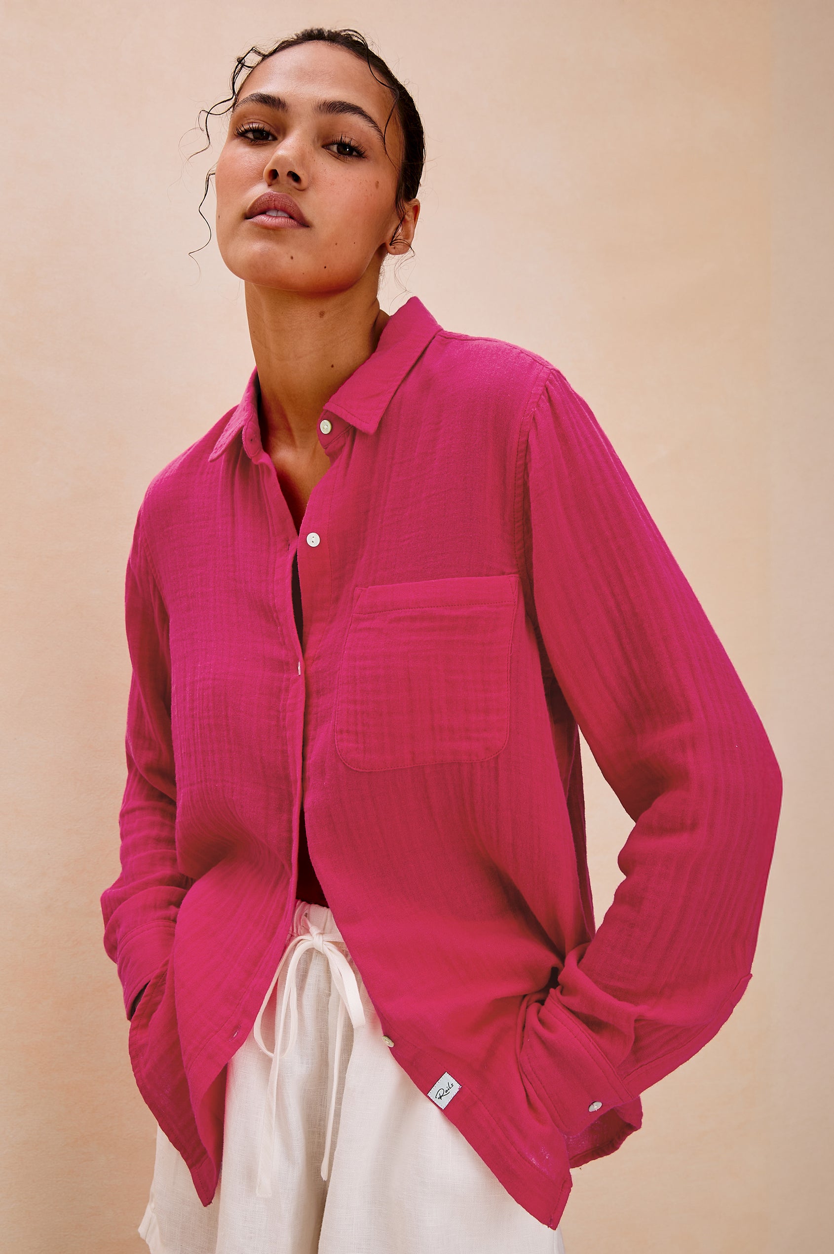 Ellis Relaxed Collared Button Front Shirt with Long Sleeves and a Chest Pocket in Raspberry Colorway. Front View Shown on Model.