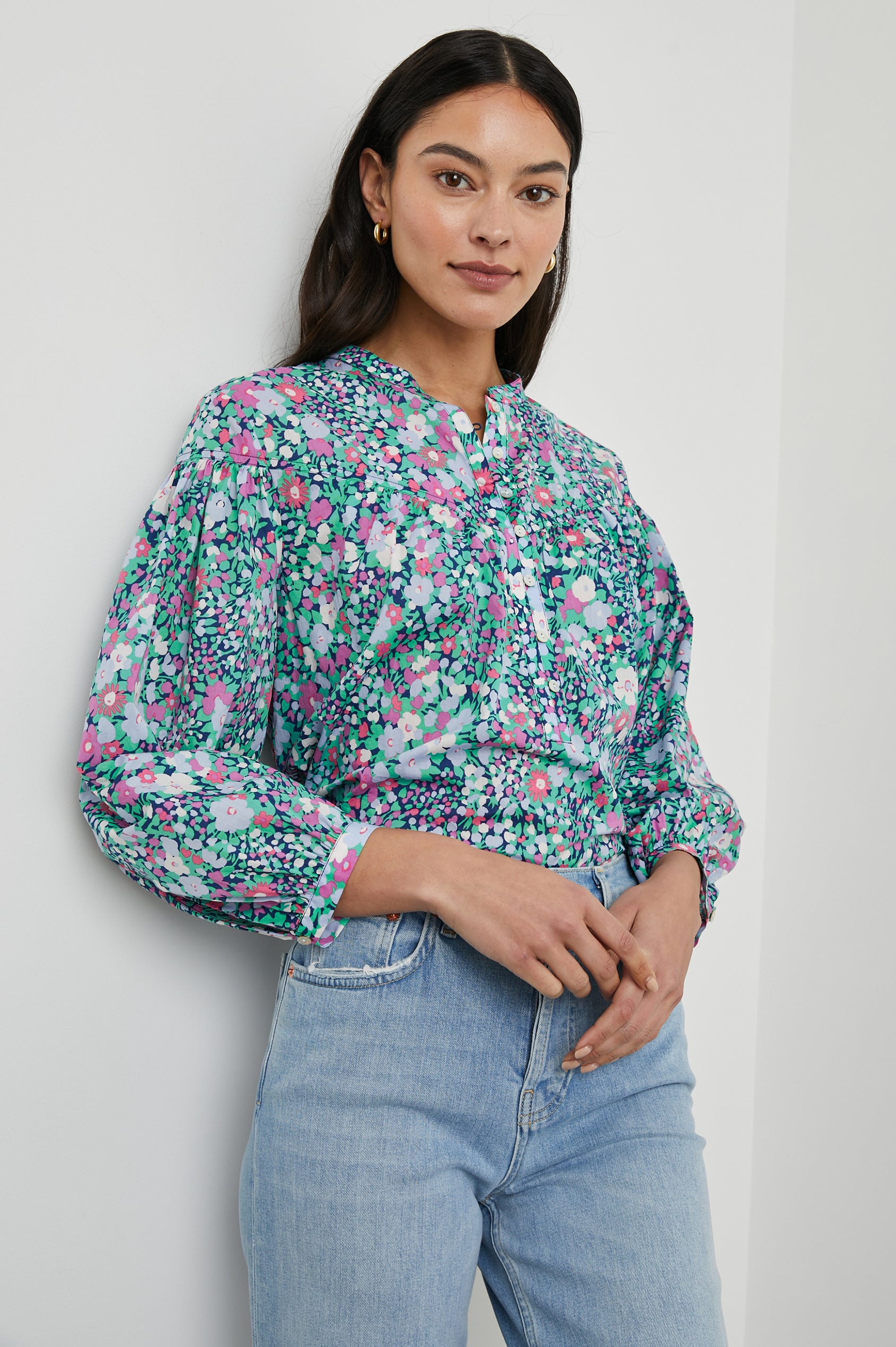 Ellison Top with Three-Quarter Sleeves, a Seven-Button Placket, and Button Cuffs in Navy Leilani Floral Colorway, Purples, Pinks and Greens on Navy - Front View Featured on Model 