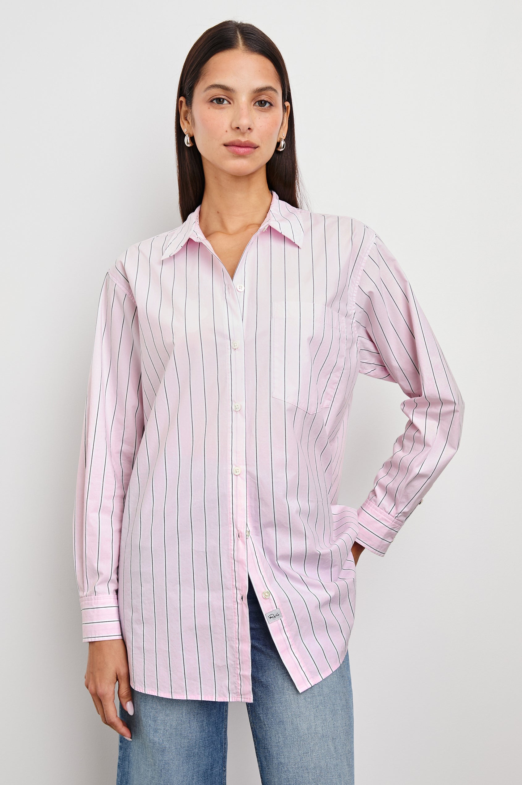 Elsa Long-Sleeve Button Down Shirt with Chest Patch Pocket in Cherry Blossom Stripe Colorway, Thin Black and White Vertical Stripes on Pink - Front Untucked View Featured on Model