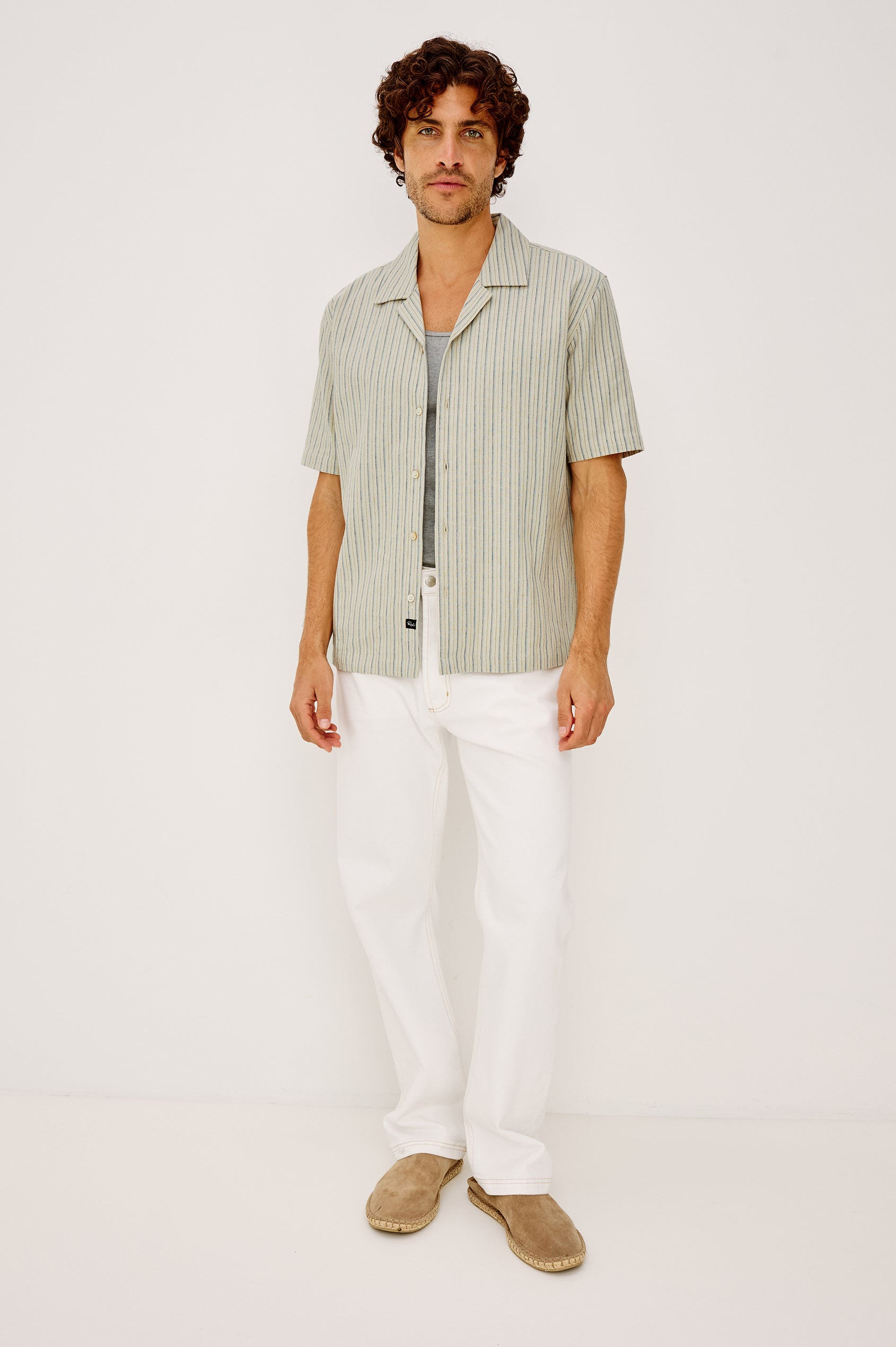 Ely Camp Shirt in Homespun Weave With Collar, Short Sleeves, Front Buttons, and Slightly-Boxy Fit in Multi Stripe Colorway - Full Body Front View Featured on Model