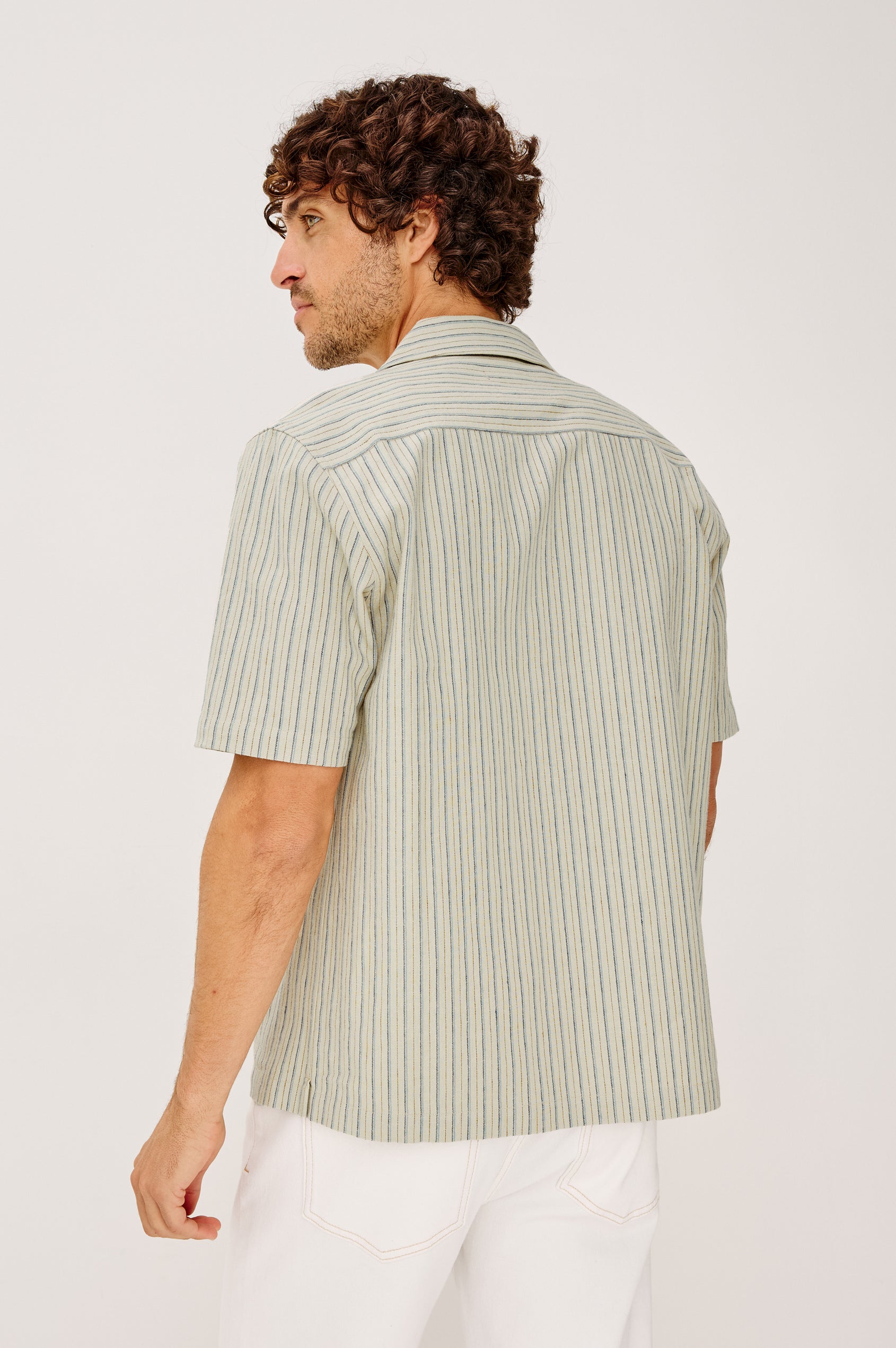 Ely Camp Shirt in Homespun Weave With Collar, Short Sleeves, Front Buttons, and Slightly-Boxy Fit in Multi Stripe Colorway - Upper Body Back View Featured on Model