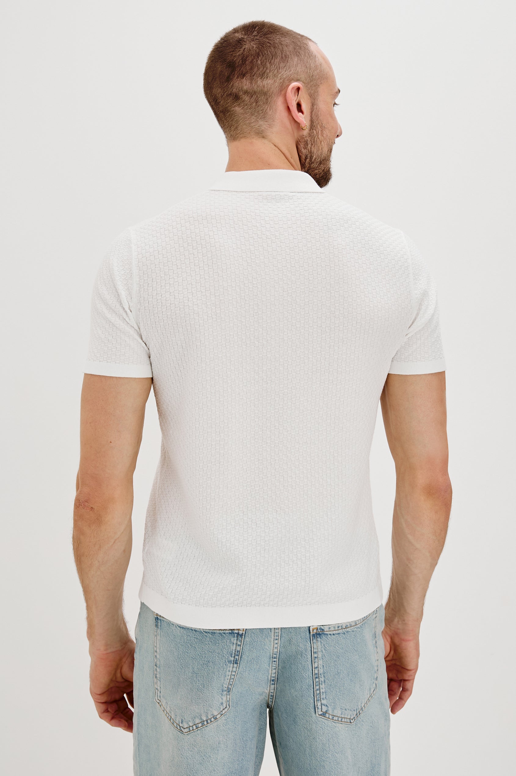 Emilio Collared Snap Front Knit Shirt with Short Sleeves and Contrast Black Snaps in White Colorway. Front View Shown on Model.