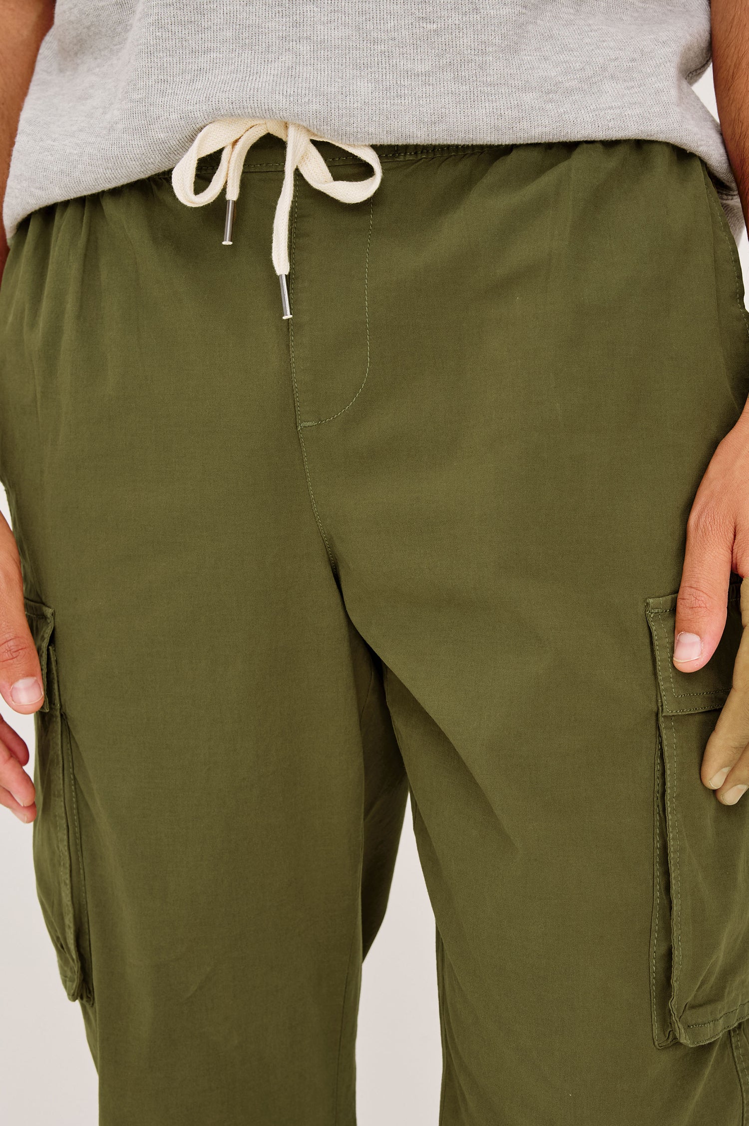 Emmerson Pant in Lightweight Cotton With Cargo Pockets and Drawstring Waist in Olive Colorway - Lower Body Front View Featured on Model