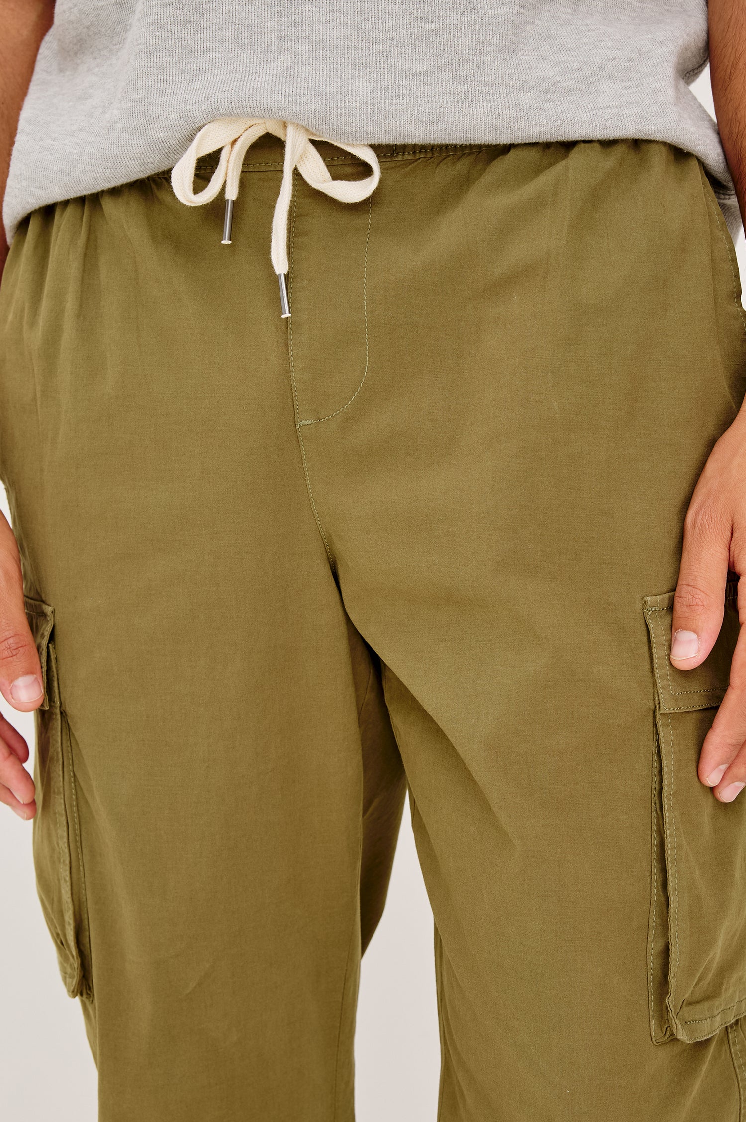 Emmerson Pant in Lightweight Cotton With Cargo Pockets and Drawstring Waist in Olive Colorway - Lower Body Front View Featured on Model