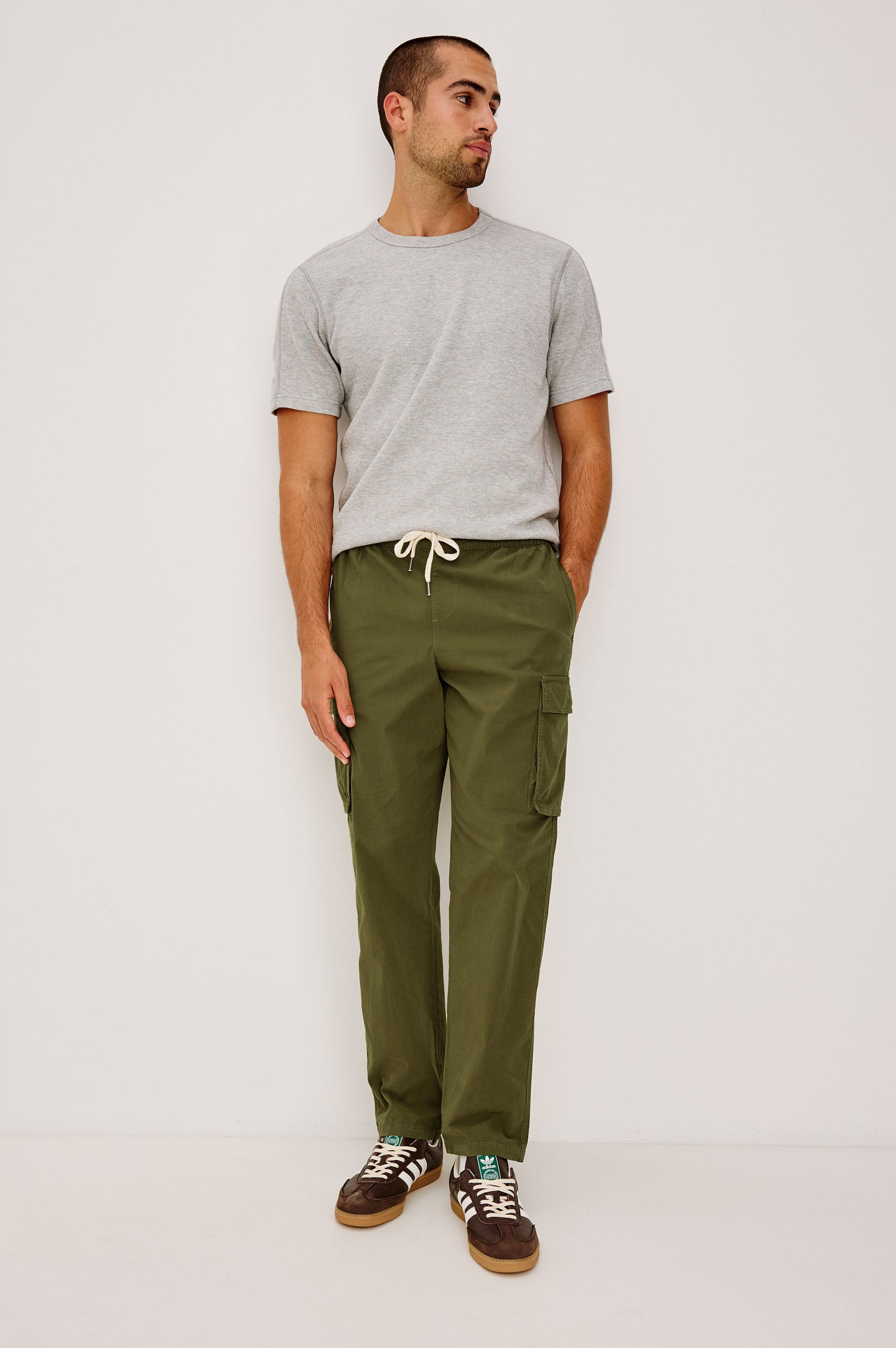 Emmerson Pant in Lightweight Cotton With Cargo Pockets and Drawstring Waist in Olive Colorway - Full Body Front View Featured on Model