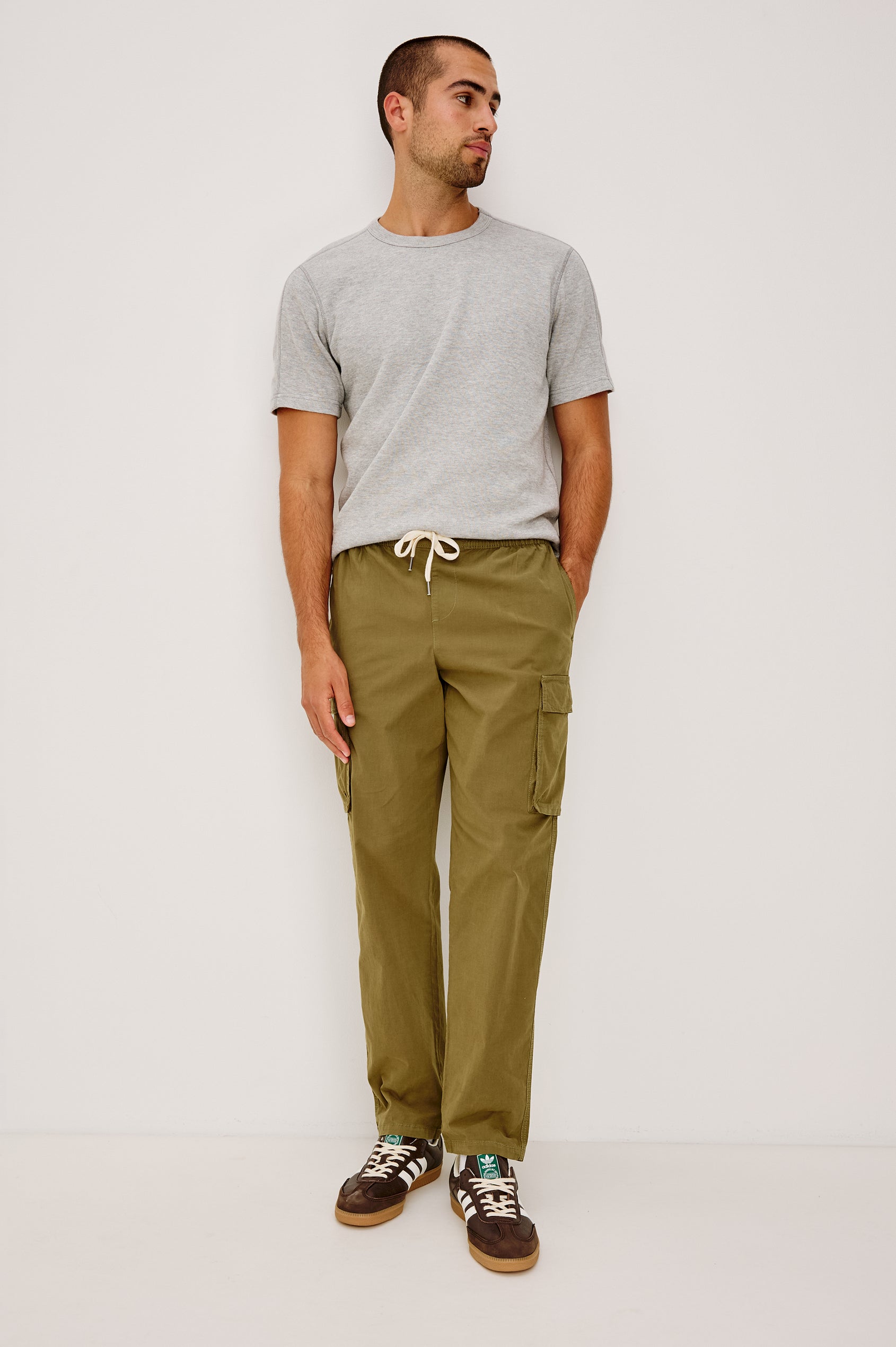 Emmerson Pant in Lightweight Cotton With Cargo Pockets and Drawstring Waist in Olive Colorway - Full Body Front View Featured on Model