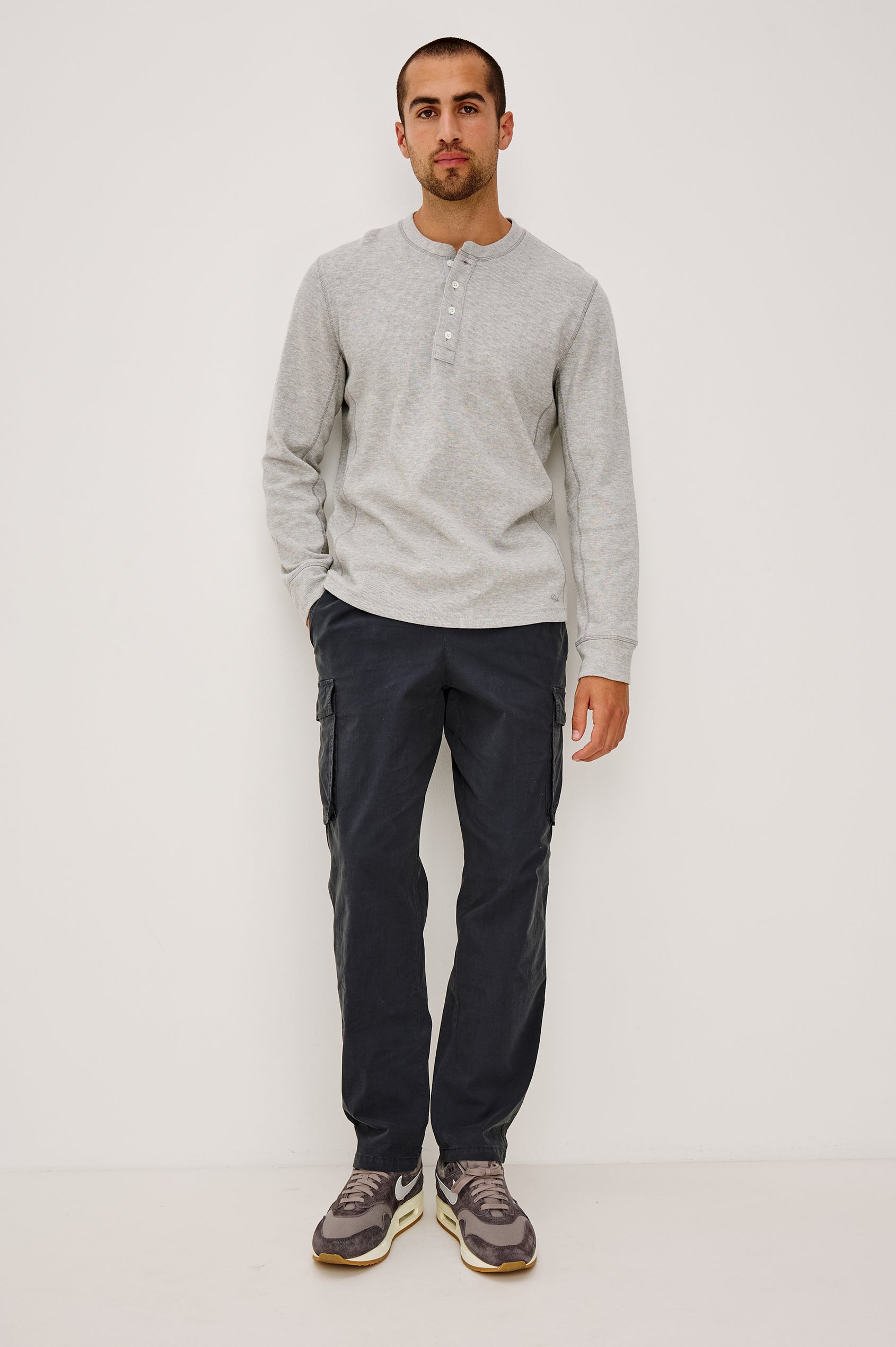 Emmerson Pant in Lightweight Cotton With Cargo Pockets and Drawstring Waist in Washed Black Colorway - Full Body Front View Featured on Model