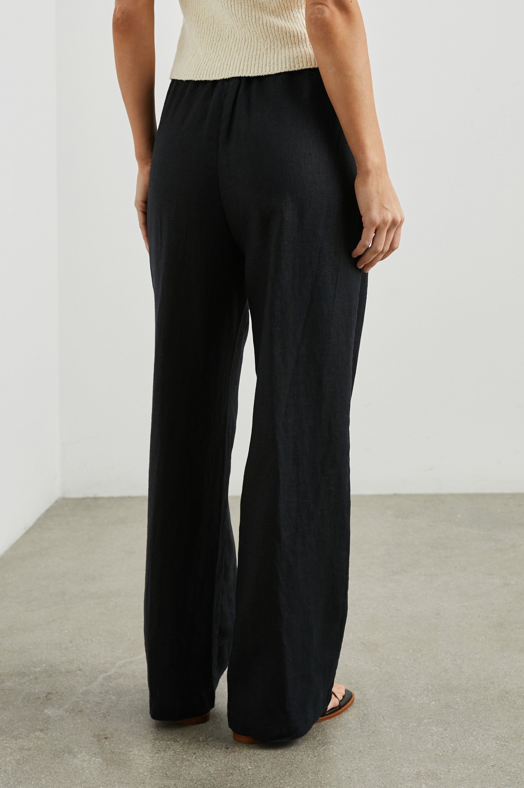 Emmie Pants with a Drawstring Waist and Two Front Pockets in Black Colorway - Back View Featured on Model