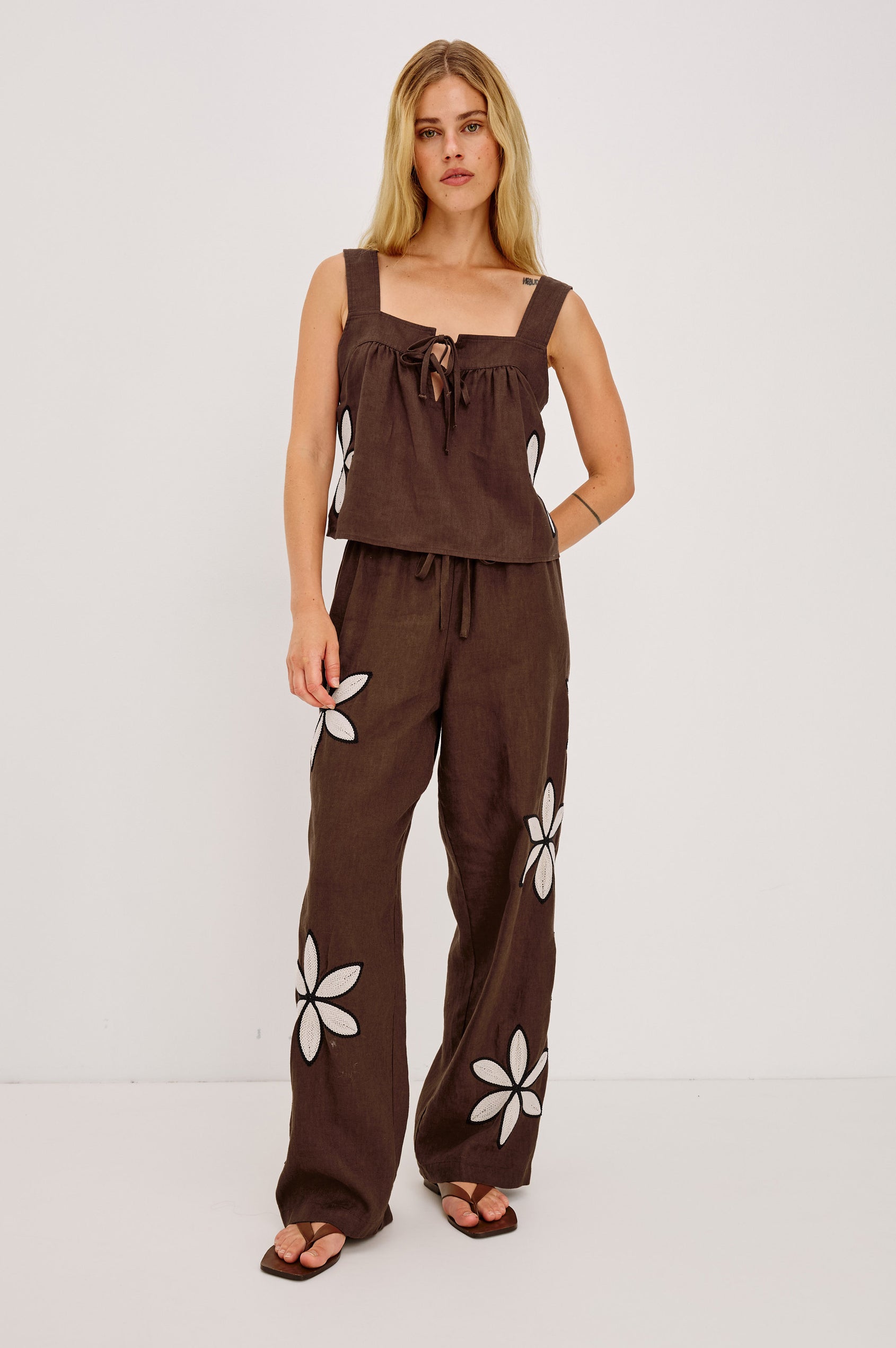 Emmie Straight Leg Pant in Unlined Linen With Adjustable Drawstring Waist Ties and Side Pockets in Cocoa Floral Embroidery Colorway — Full Body Front View Featured on Model