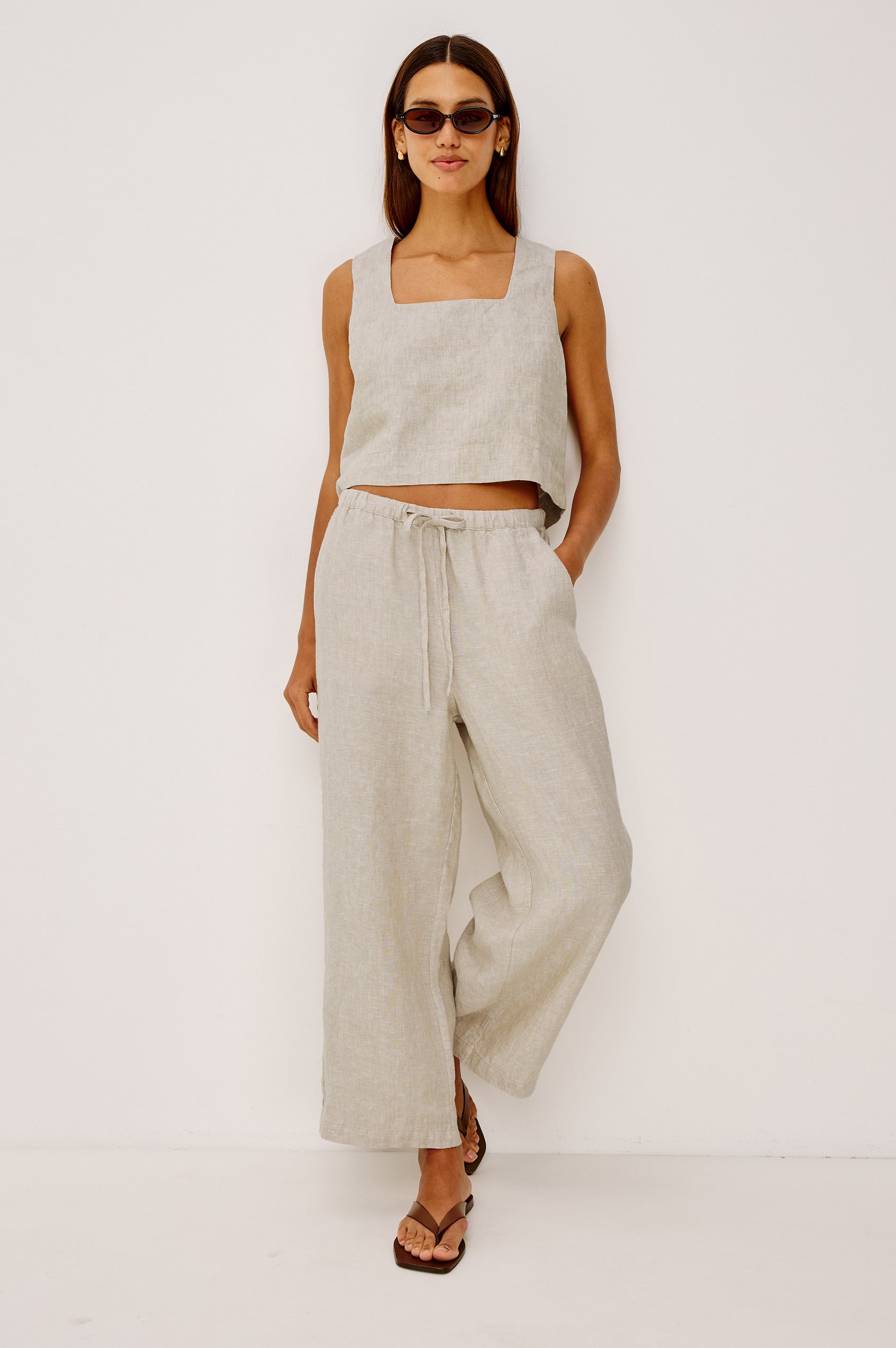 Emmie Crop Pant in Linen With Straight Legs, Adjustable Drawstring Waist Ties, and Side Pockets in Heathered Flax Colorway - Full Body Front View Featured on Model