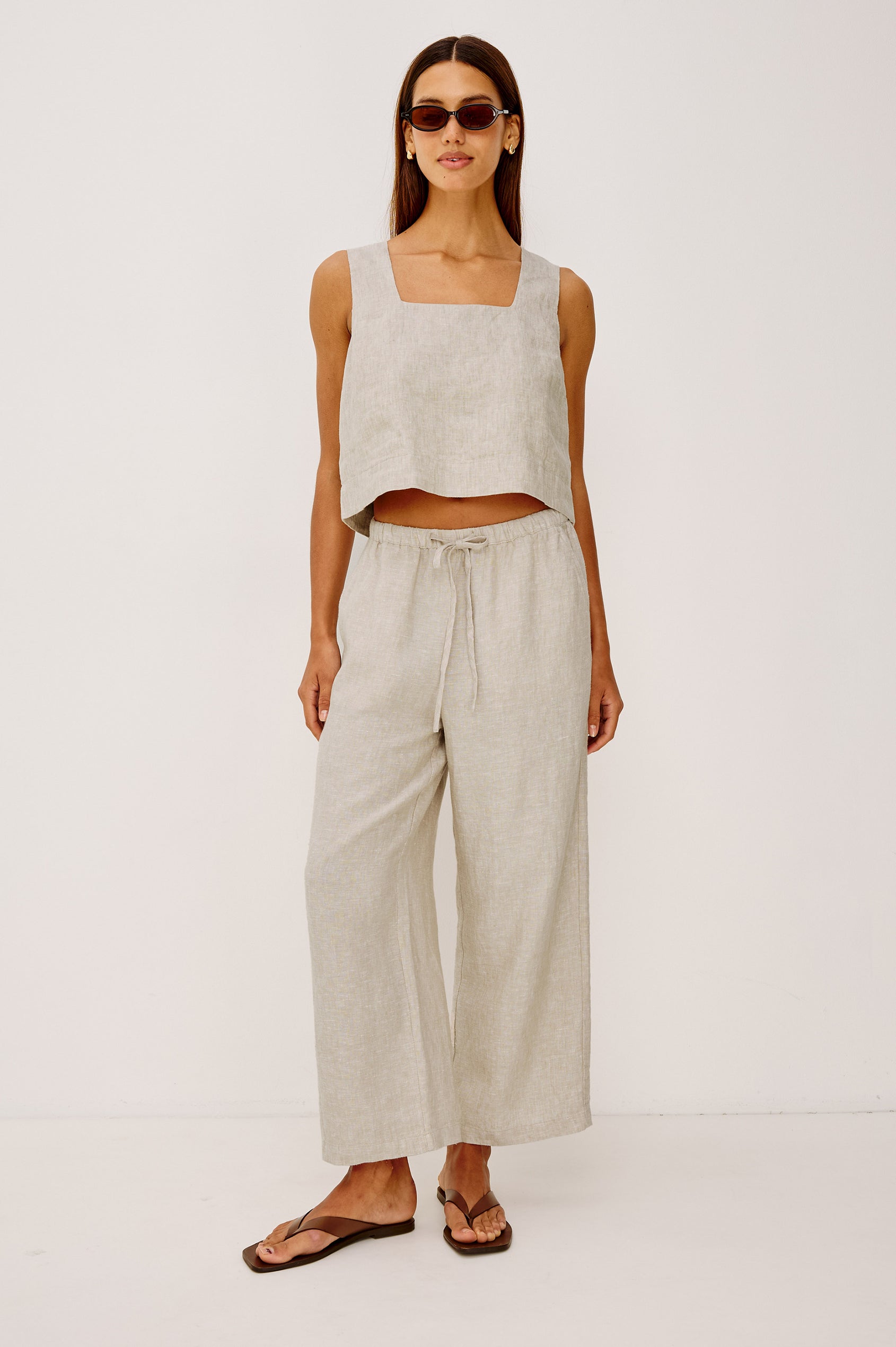 Emmie Crop Pant in Linen With Straight Legs, Adjustable Drawstring Waist Ties, and Side Pockets in Heathered Flax Colorway - Full Body Front View Featured on Model