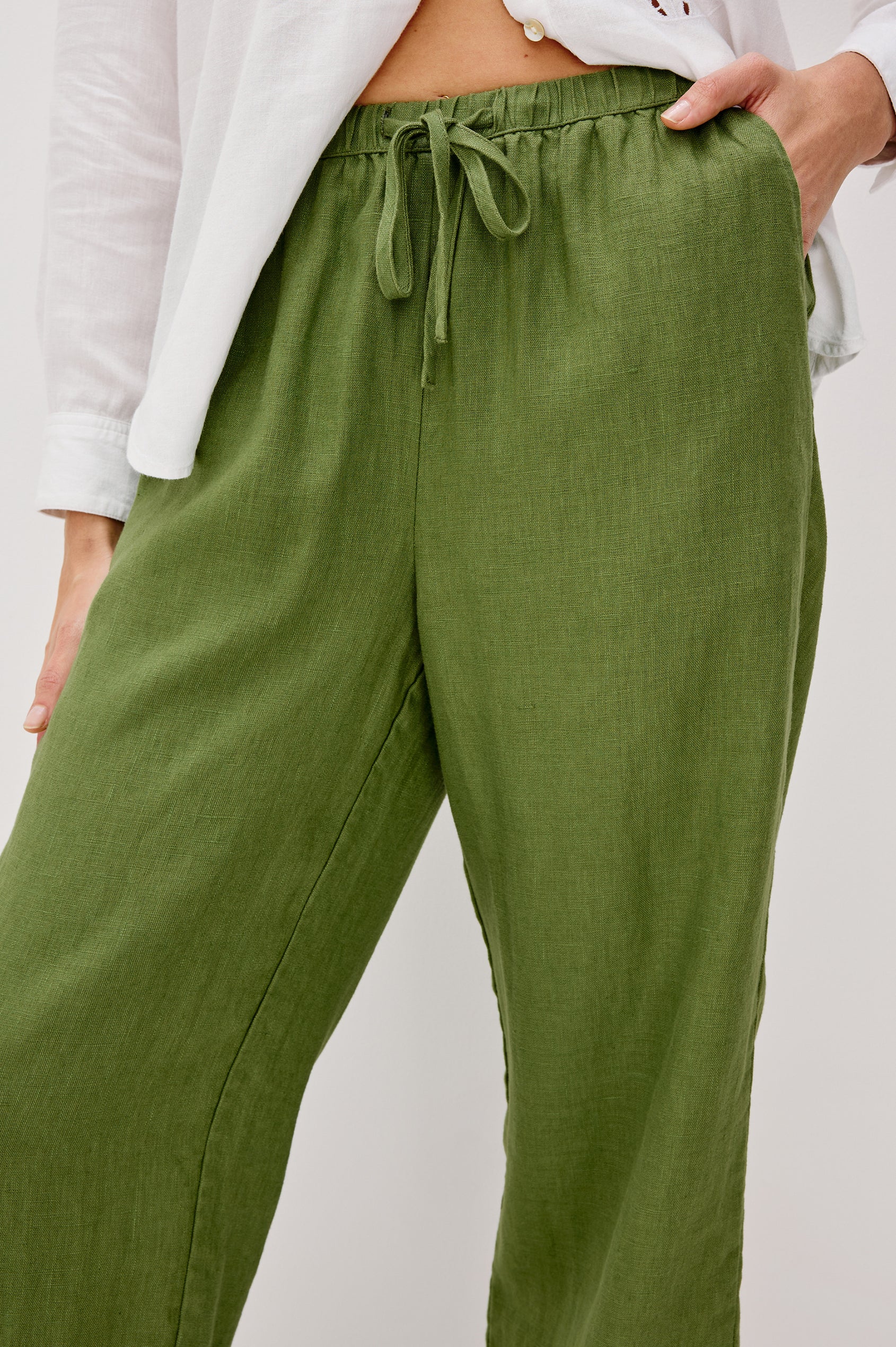 Emmie high rise linen wide leg pant with drawstring in Dill colorway- front detail view on model.